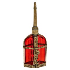 Used Moroccan Perfume Bottle Sprinkler with Embossed Metal Overlay and Red Glass