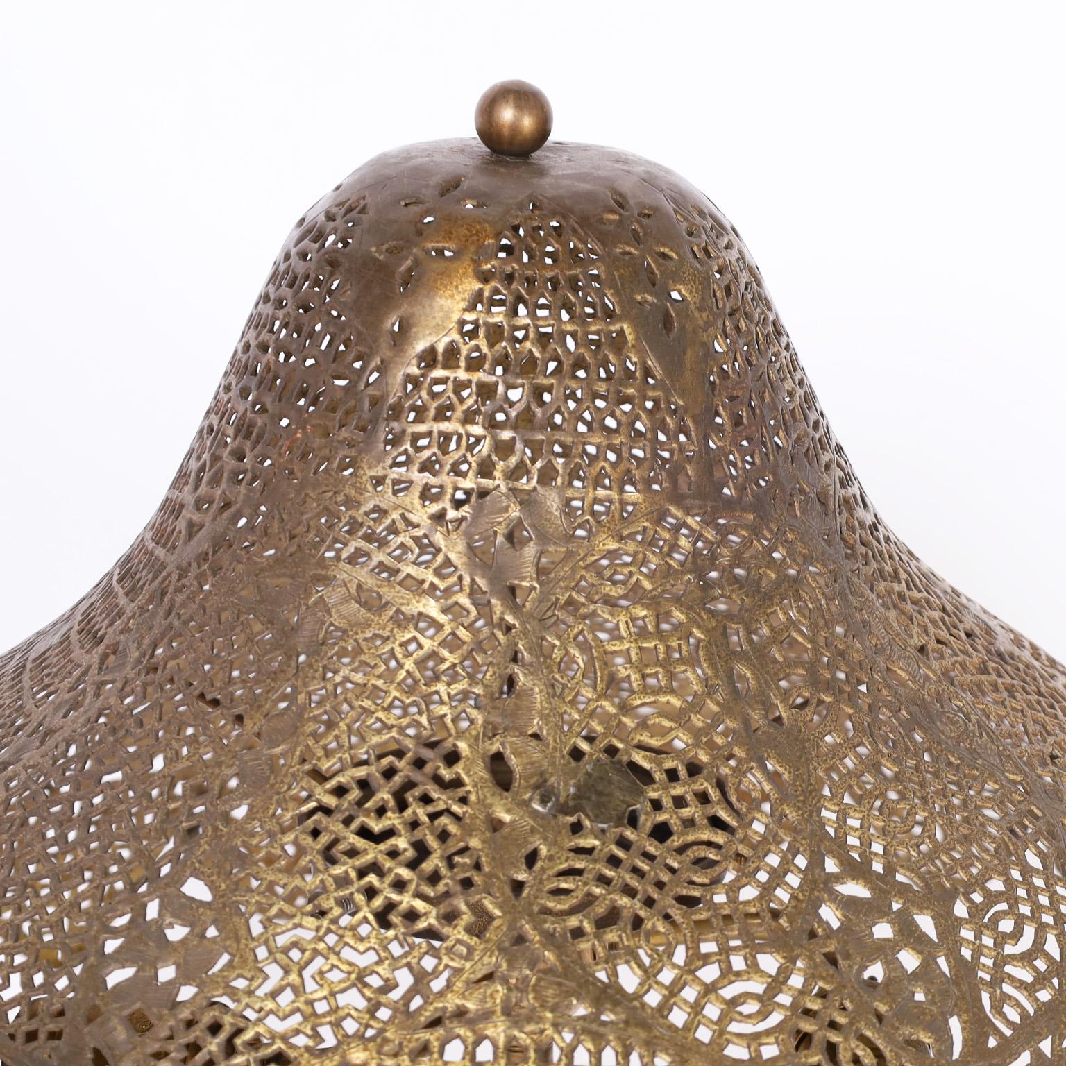 Moroccan table lamp and the original matching shade both crafted in brass with pierced geometric designs and classic form.