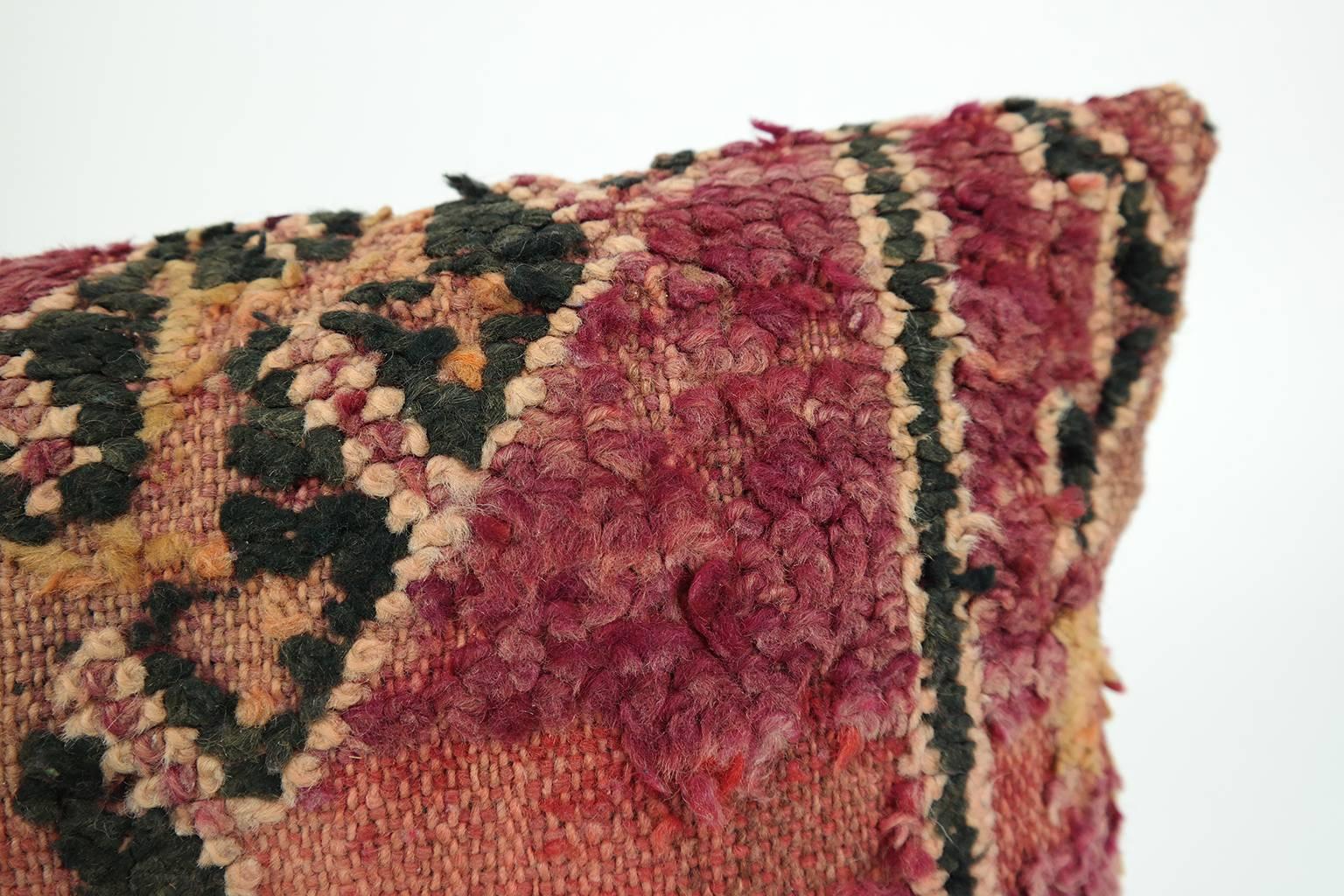 Cushion custom made from a more than 50 years old Moroccan rug, searched and selected by ourselves. This pillow is a one-of-a-kind with beautiful deep warm aubergine and red colors. The beauty of our pillows is that they are timeless and blend in