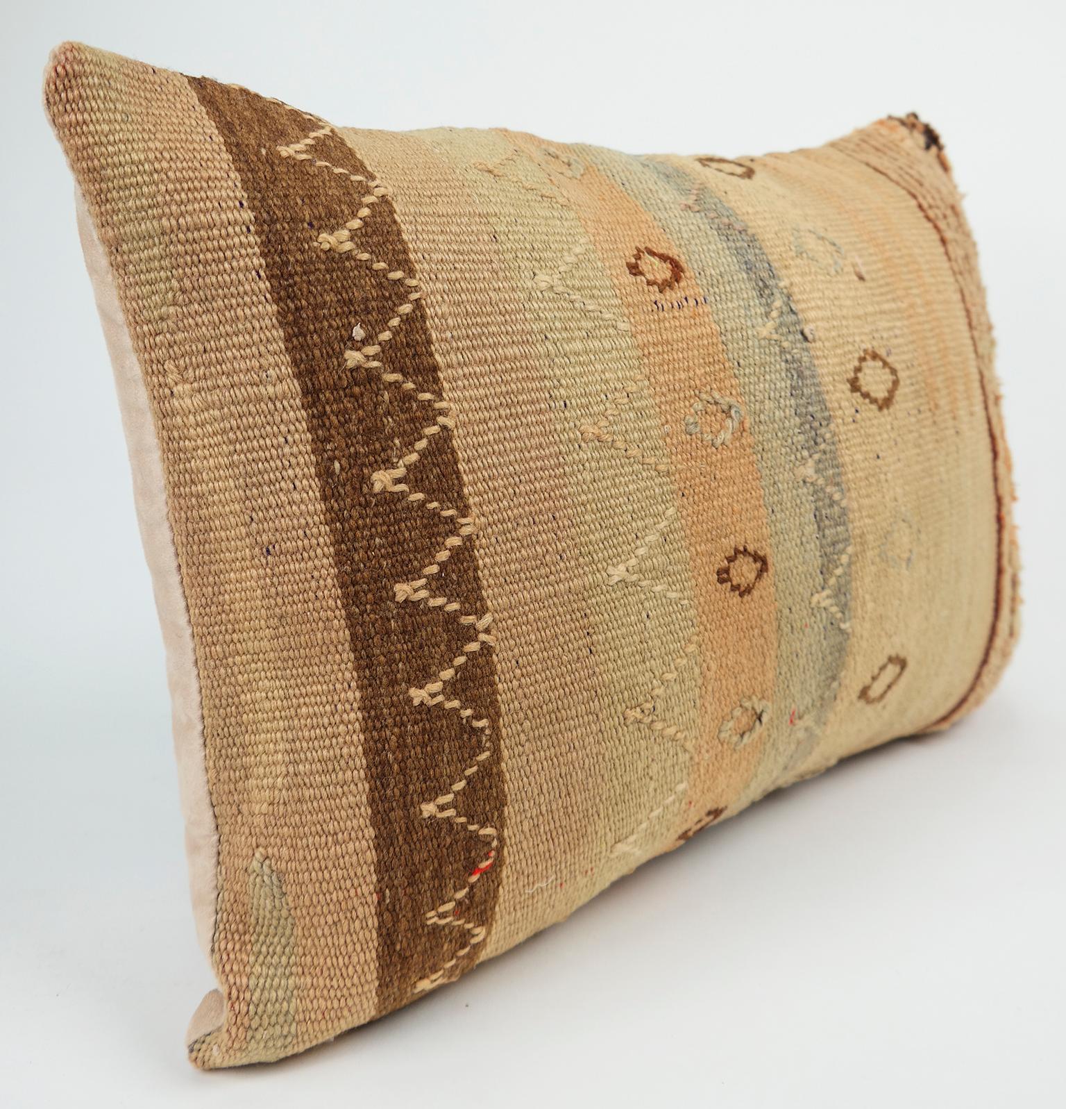 Cushion custom-made from a more than 35 years old Moroccan rug, searched and selected by ourselves. This pillow is a one-of-a-kind with beautiful warm colors. The beauty of our pillows is that they are timeless and blend in every interior. Or