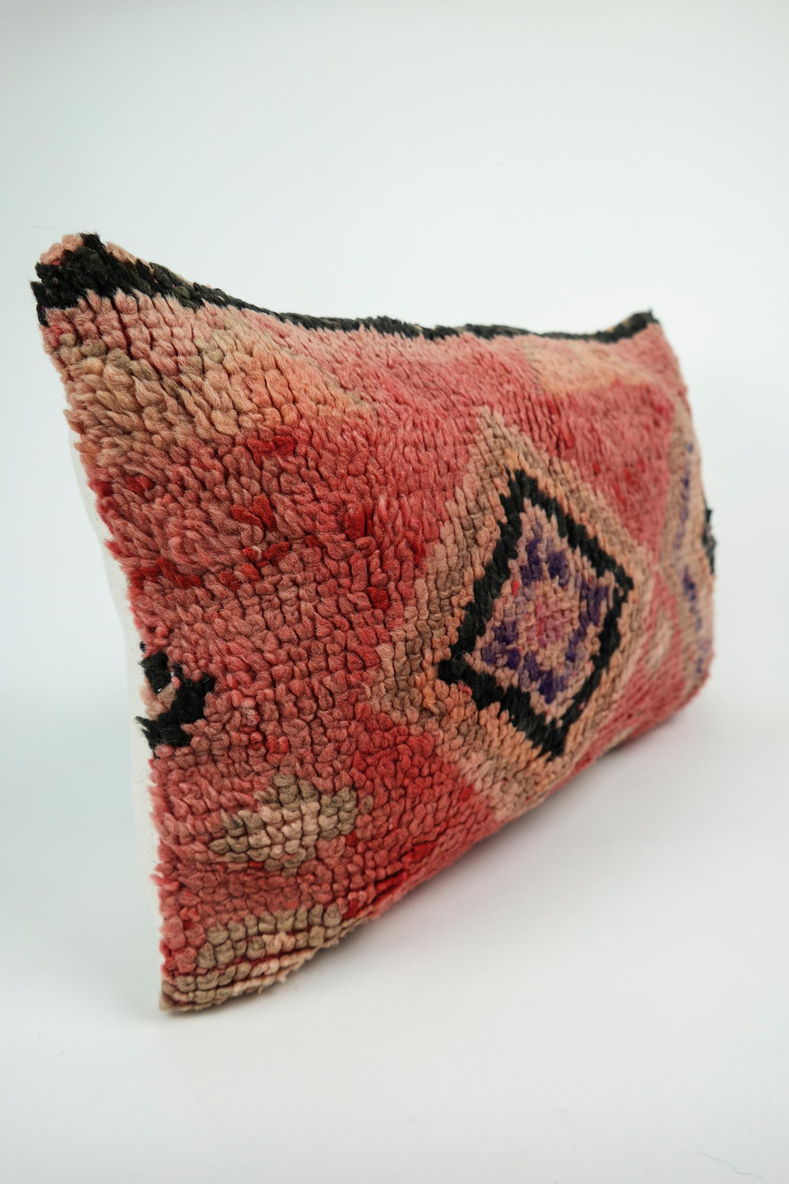 Cushion custom-made from a more than 35 years old Moroccan rug, searched and selected by ourselves. This pillow is a one-of-a-kind with beautiful warm colors. The beauty of our pillows is that they are timeless and blend in every interior. Or