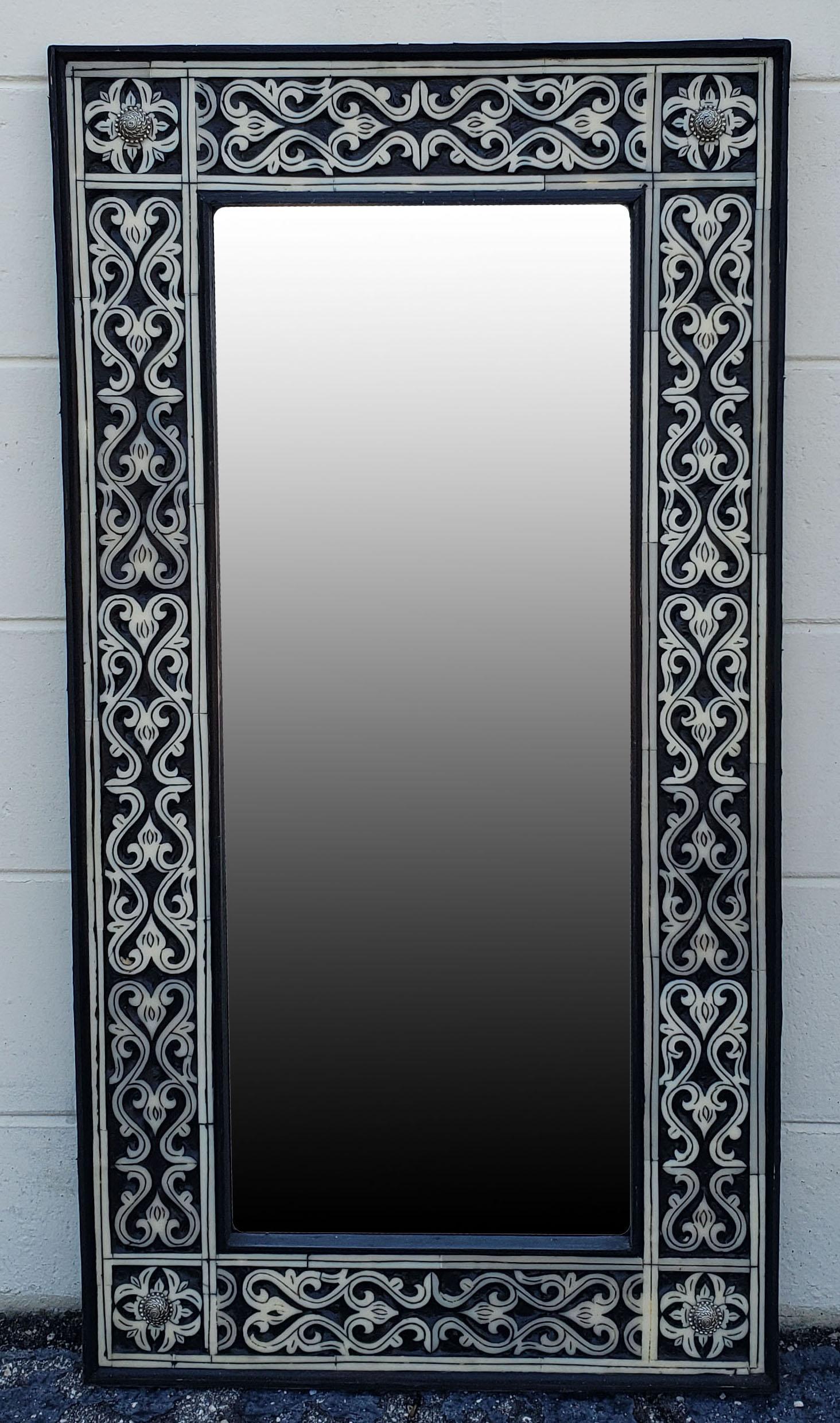 A few decades old.
Medium size metal and camel bone inlay Moroccan mirror. Made in the city of Marrakech. Rectangular shape, measuring approximately 40