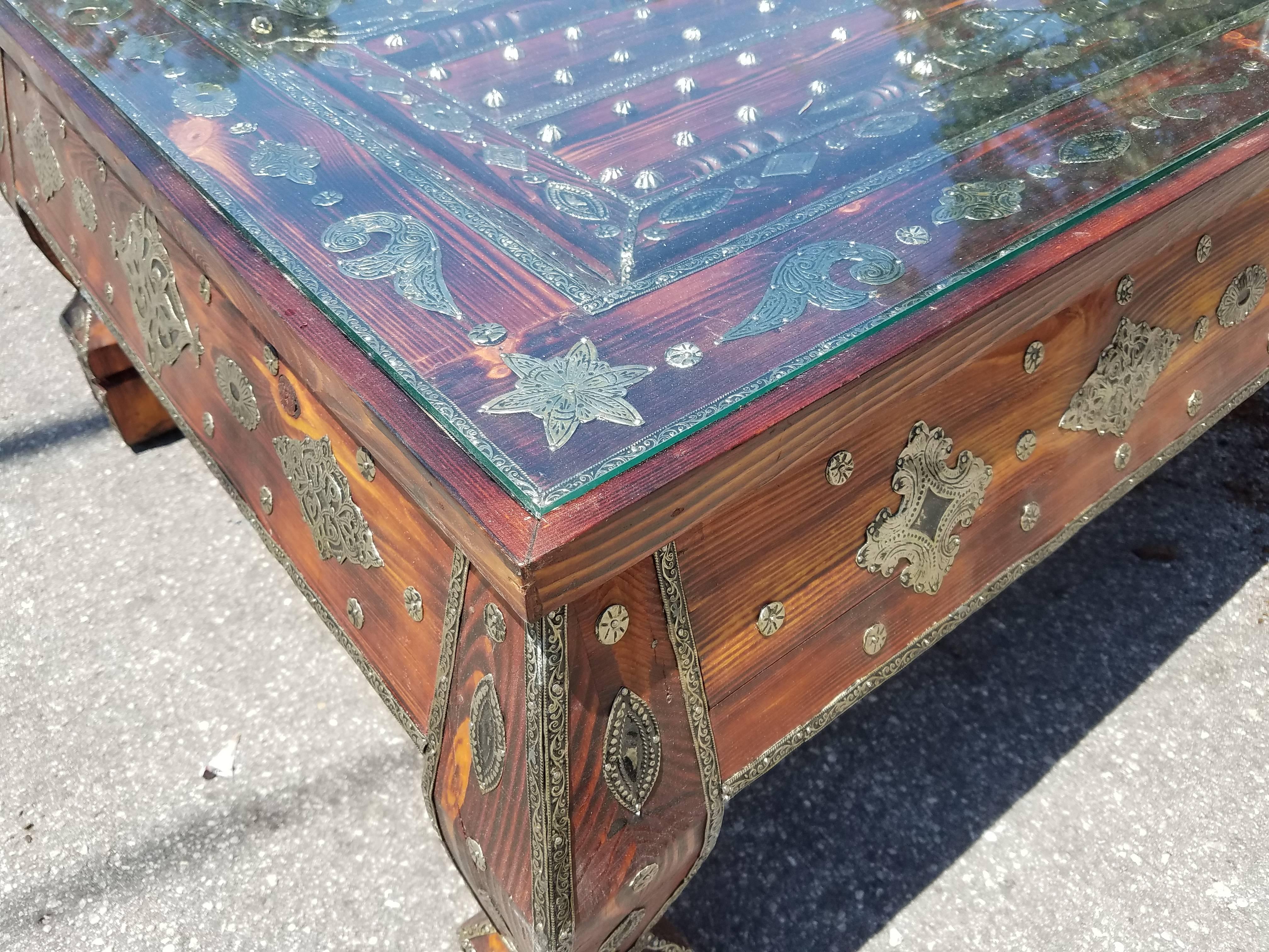 Very exotic all metal inlaid Moroccan side table. Rectangular shape and an amazing look. With its detailed carving along the sides and the top, this side table will sure be a excellent add-on to your décor. It measures approximately 48