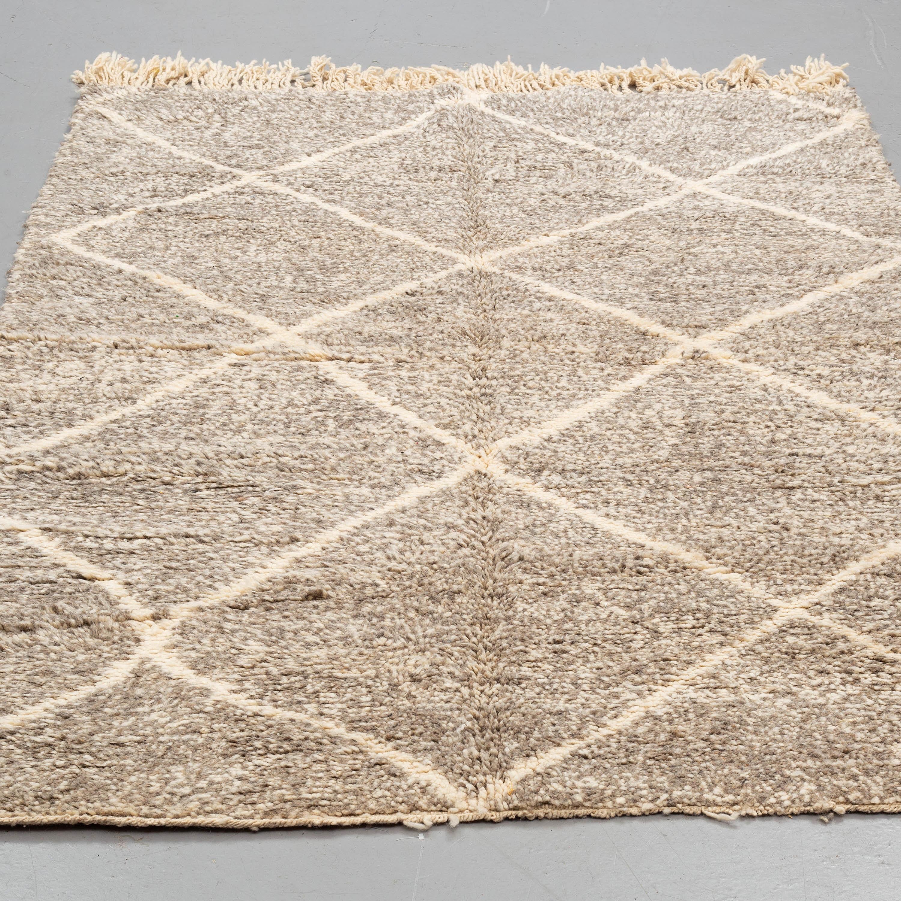 Moroccan wool rug. Insignificant wear.

