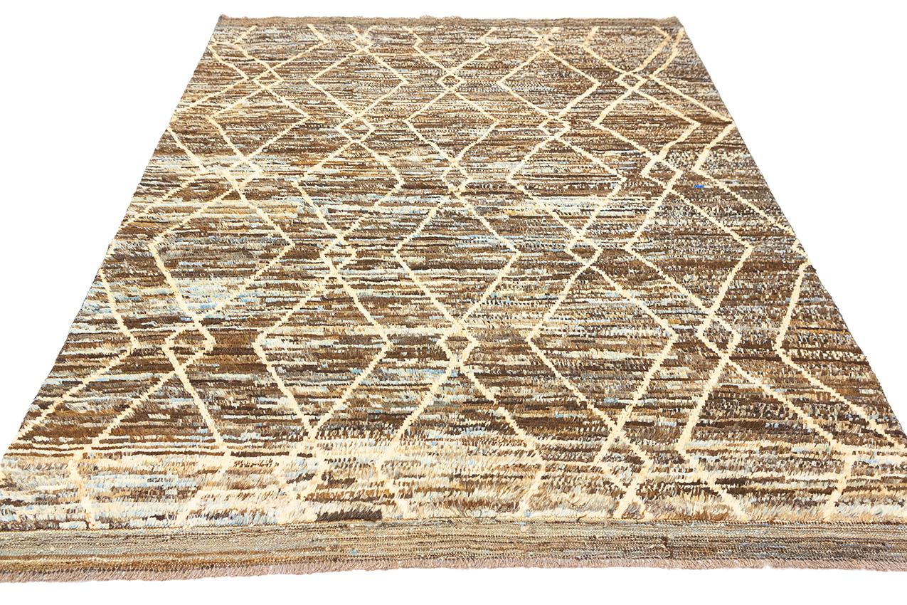 This is a Moroccan Rug, a true work of art handcrafted from genuine wool, featuring a palette of rich and earthy brown tones, and adorned with a tasteful minimalist design. This rug is a testament to the enduring legacy of Moroccan craftsmanship and