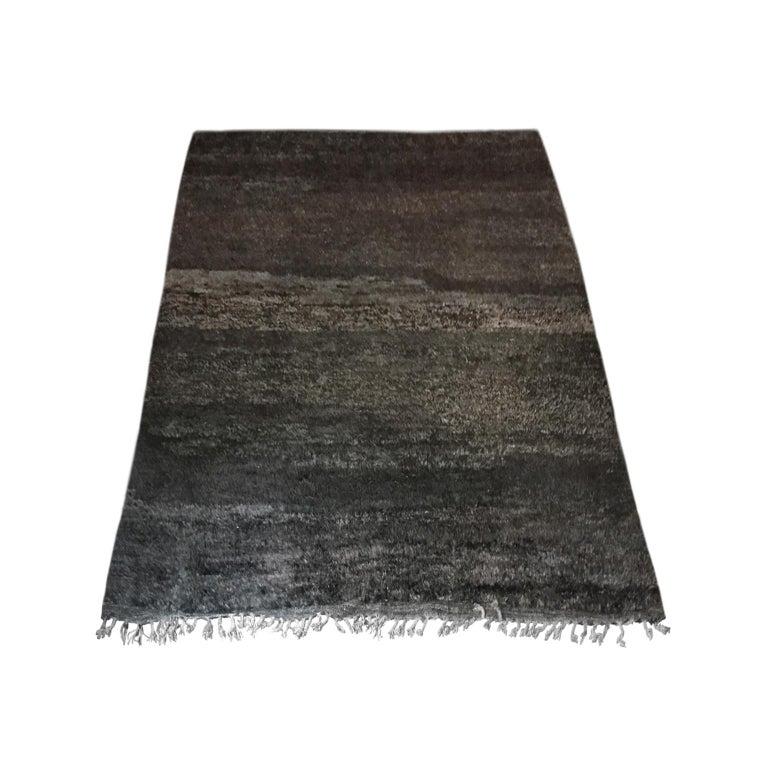 Moroccan rug in black, browns and grays.
 