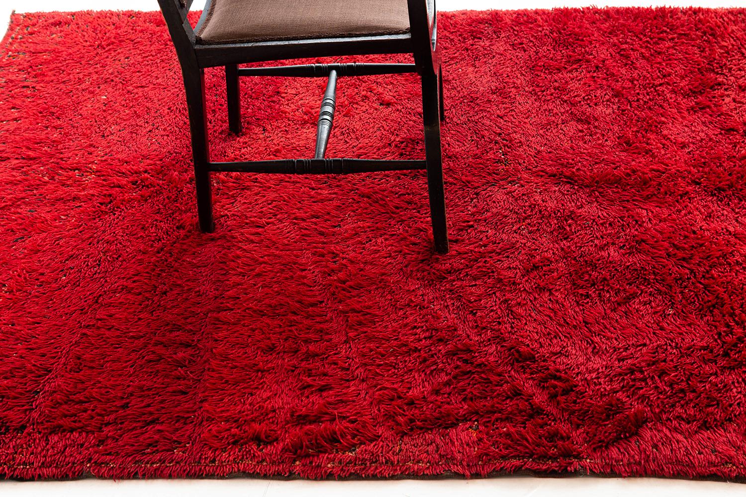 A beautiful ruby red shag from the Middle Atlas tribe of Morocco. This handwoven wool shag has a beautiful texture and color that will leave lasting impressions and liveliness to any design space.


Rug Number 21567
Size 5' 11