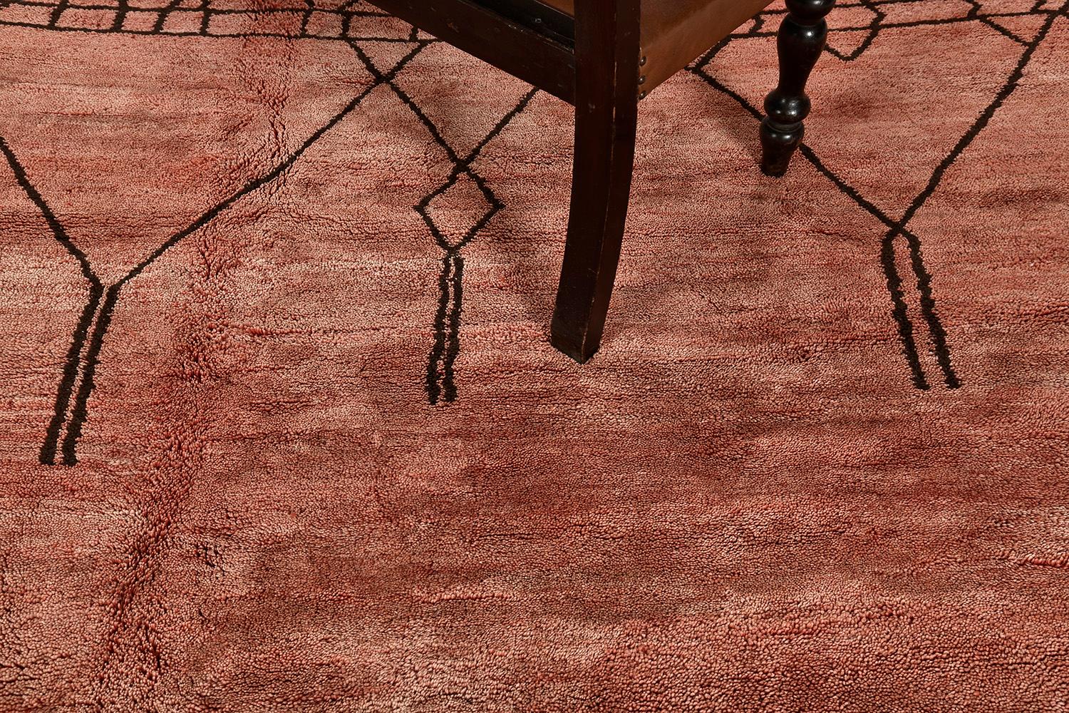Adding this up to your collection will make your guests in awe. This gorgeous Morrocan Rug features one of the stories of Middle Atlas Tribe handwoven in clay-tone wool. It makes it more unique when lozenges, zigzag, crisscross, and ambiguous Berber