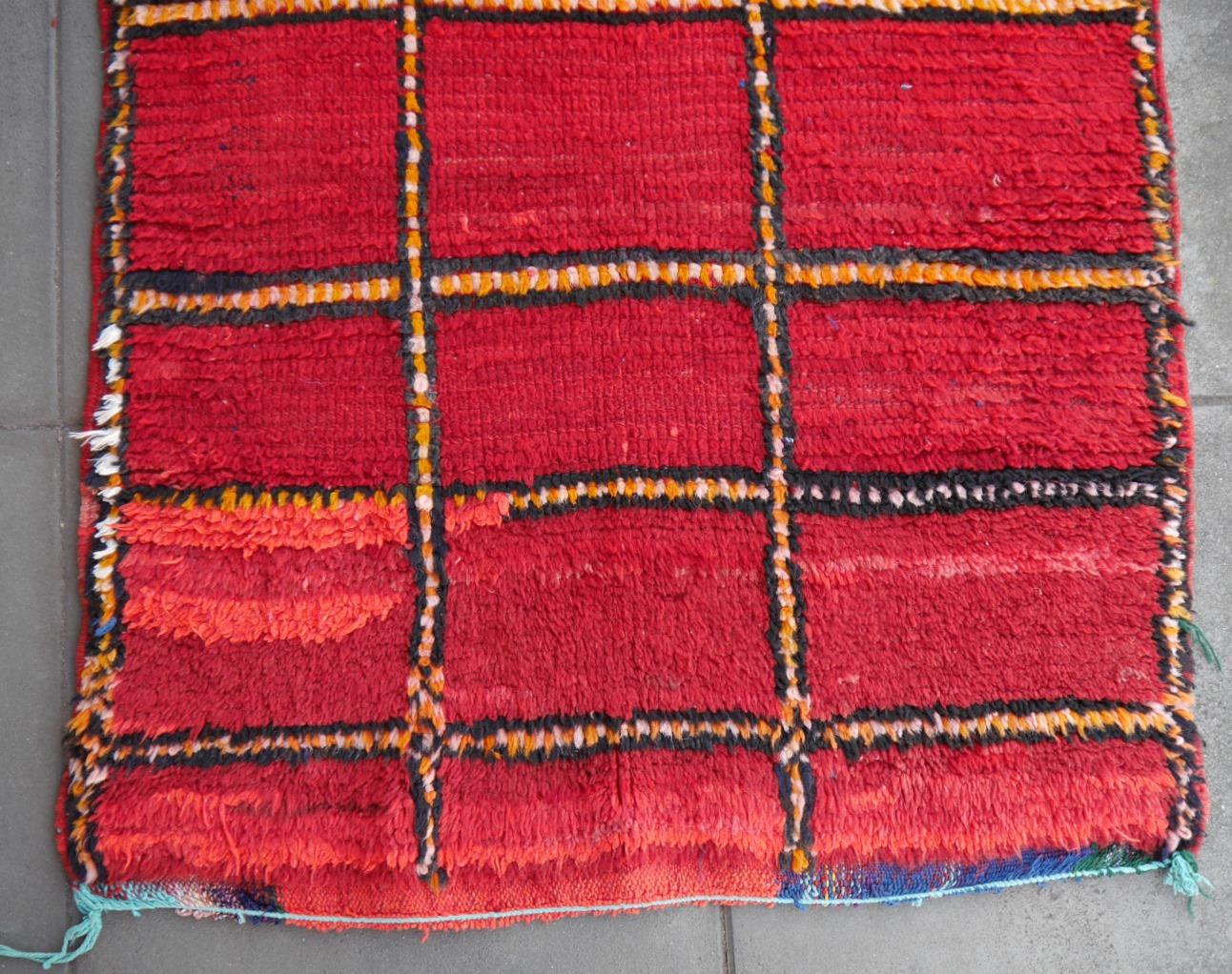 Red Vintage Moroccan Amazigh rug North African tribal design - Djoharian Collection 

Berber rugs and carpets are mainly made in Morocco, Tunesia and Algeria. Largest producer are the tribal and nomadic Berber people of Morocco. Different areas