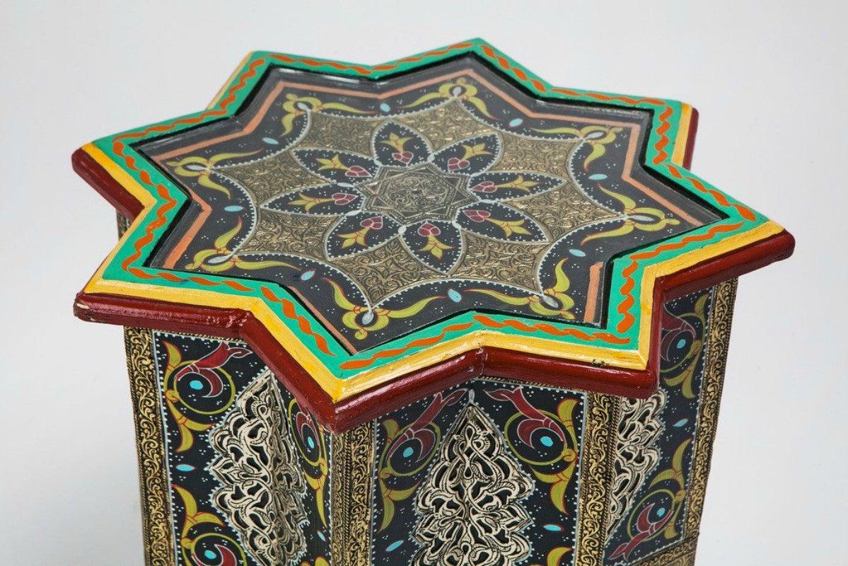 Moroccan side or end tables hand printed with brass inlay in black, a pair

This astounding star shaped wooden brass inlaid pair of side tables is an exotic and sophisticated addition to any room. Featuring a dazzling swirl of images, powerful