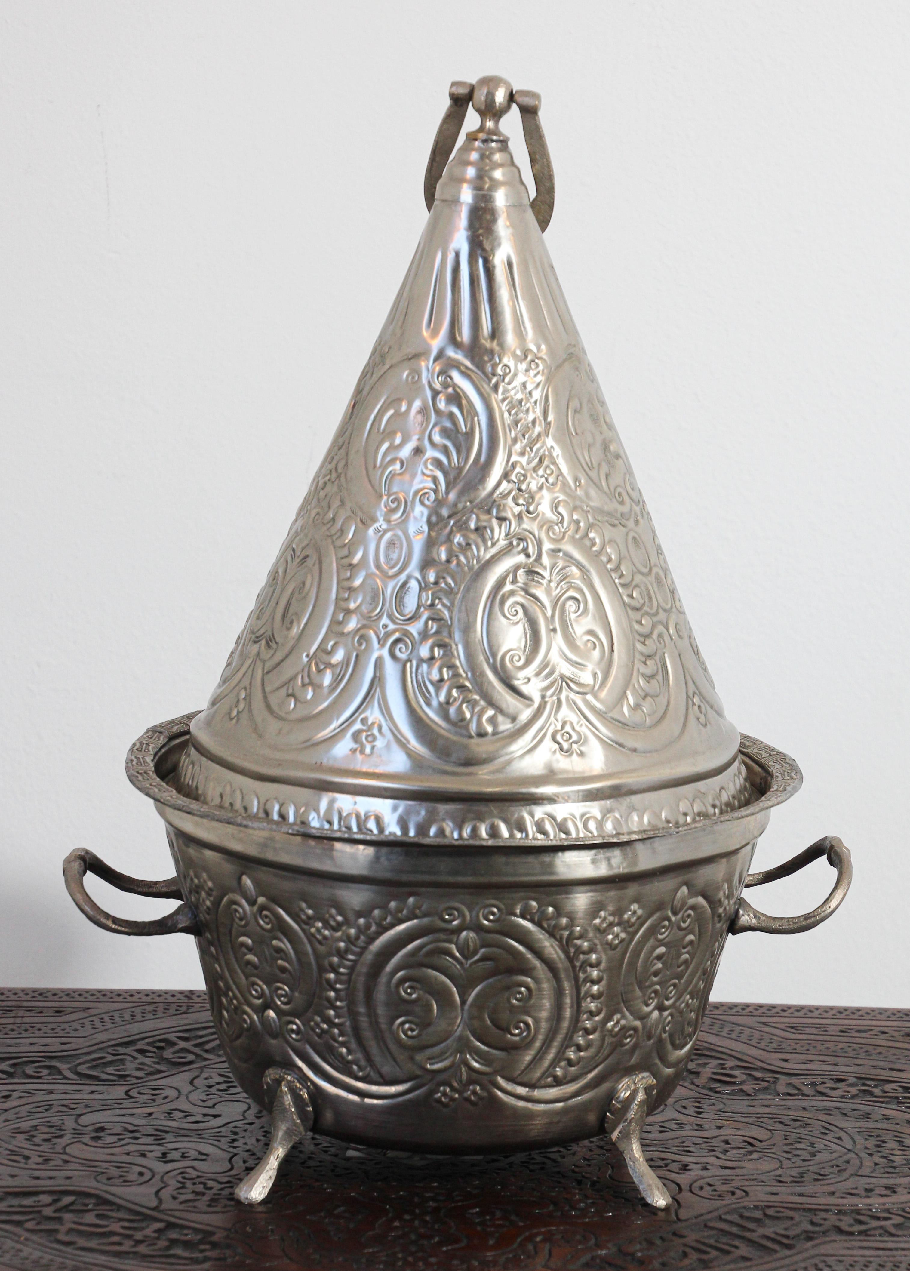 Gorgeous hand chased silver plated large Moroccan tajine dish with cover, typically used for presenting cookies or bread.
Hand chased etching and embossed motifs with metal silver finish serving dish vessel.
Very nice handcrafted large serving