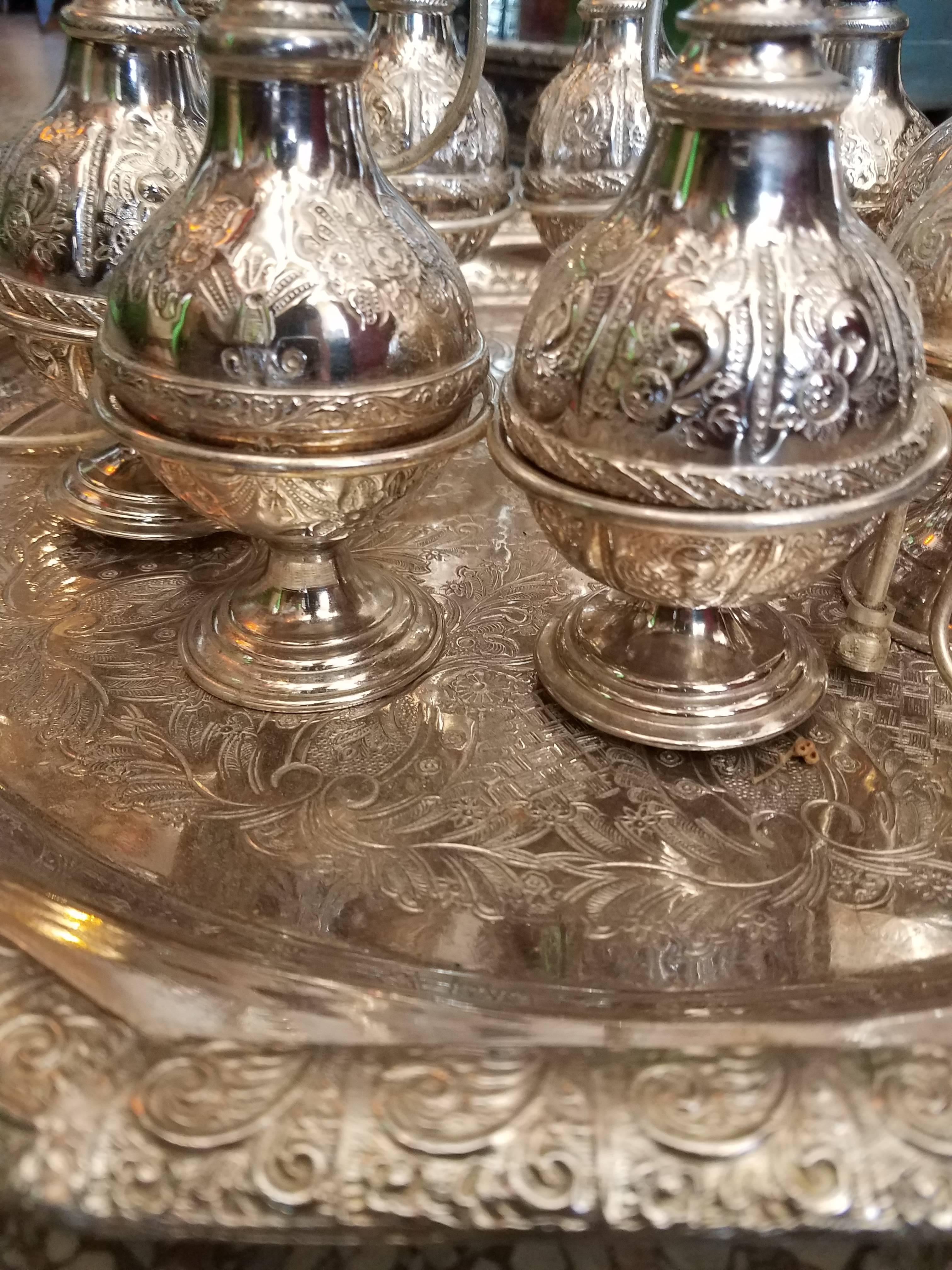 Carved Moroccan Silver Rosewater Bottles, Set of Nine and Tray For Sale