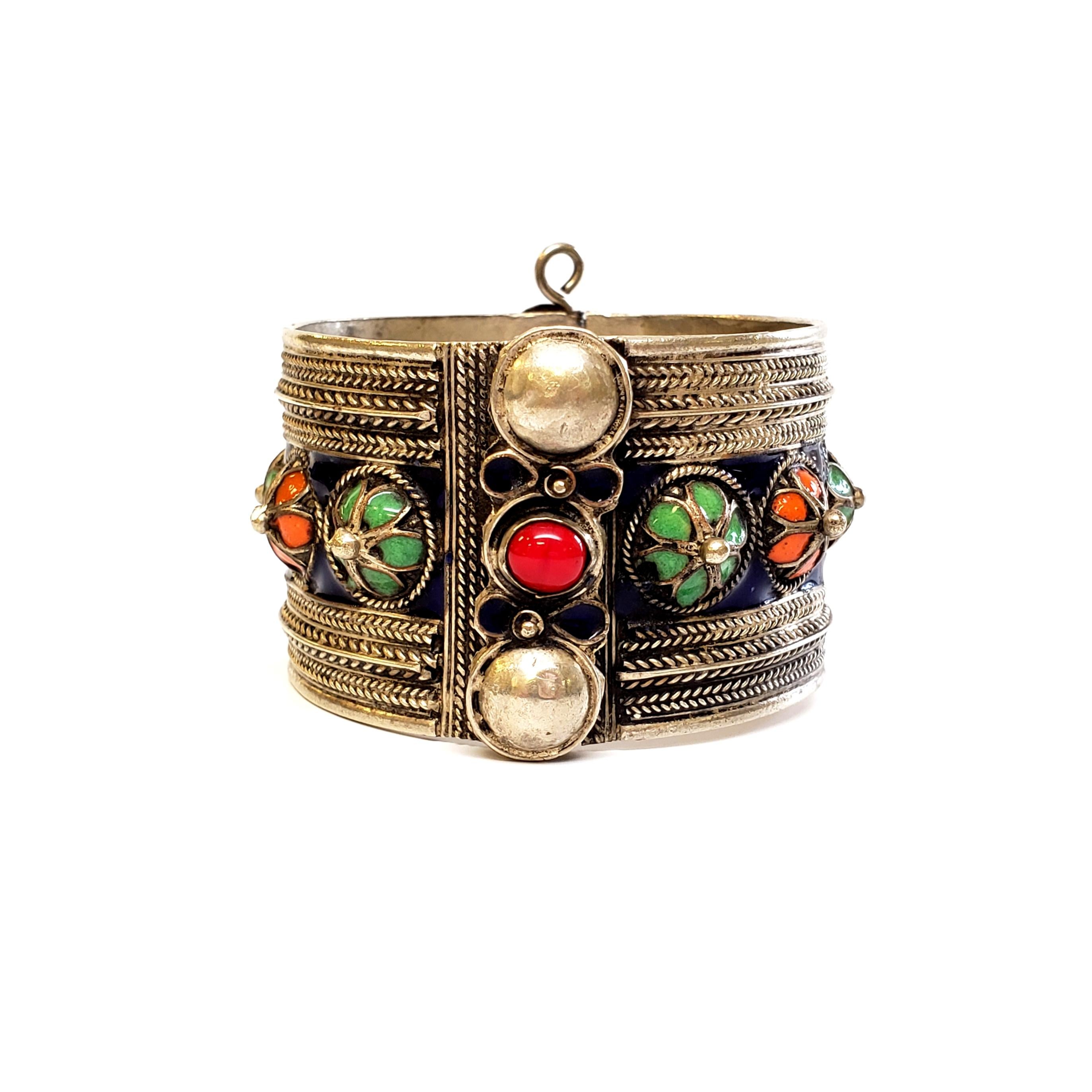 Moroccan sterling silver hinged enamel cuff bracelet, c.1910.

Beautiful example of Berber jewelry of North Africa, a social emblem of prestige and class, also spiritual meaning regarding fertility, prosperity, health and protection from the evil