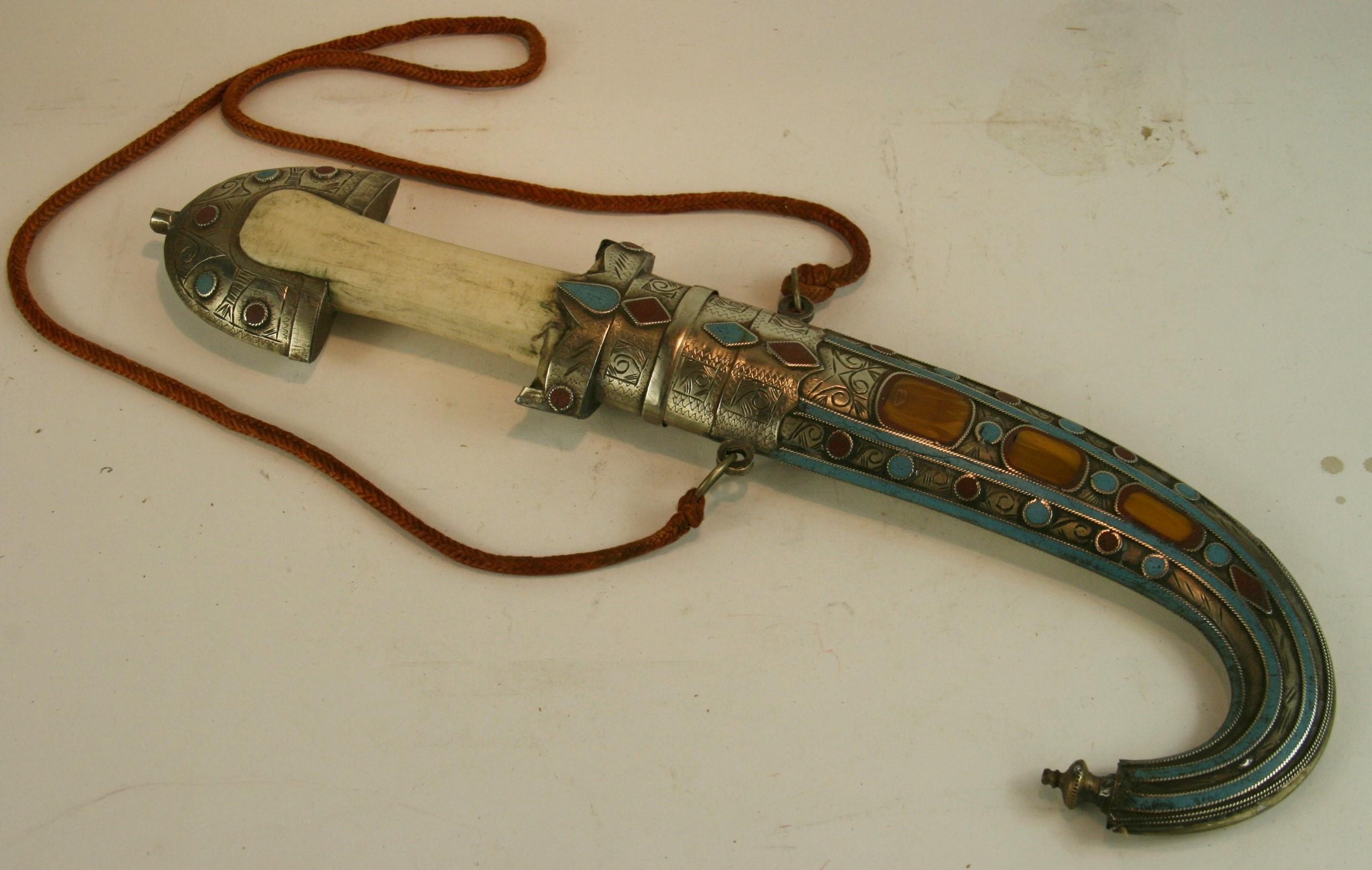 3-451 hand crafted Moroccan silver dagger with stone inlay and animal bone handle.
