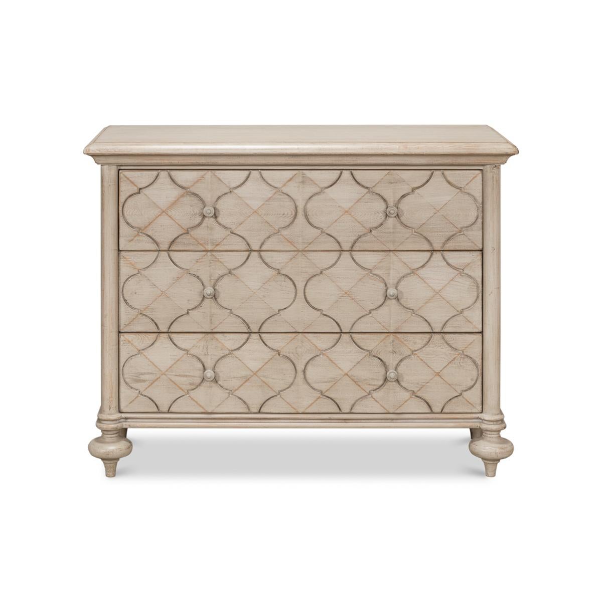 Pine wood painted three-drawer dresser in a stone-grey antiqued finish. With a rectangular molded edge raised on turned taupee feet.

Dimensions: 44