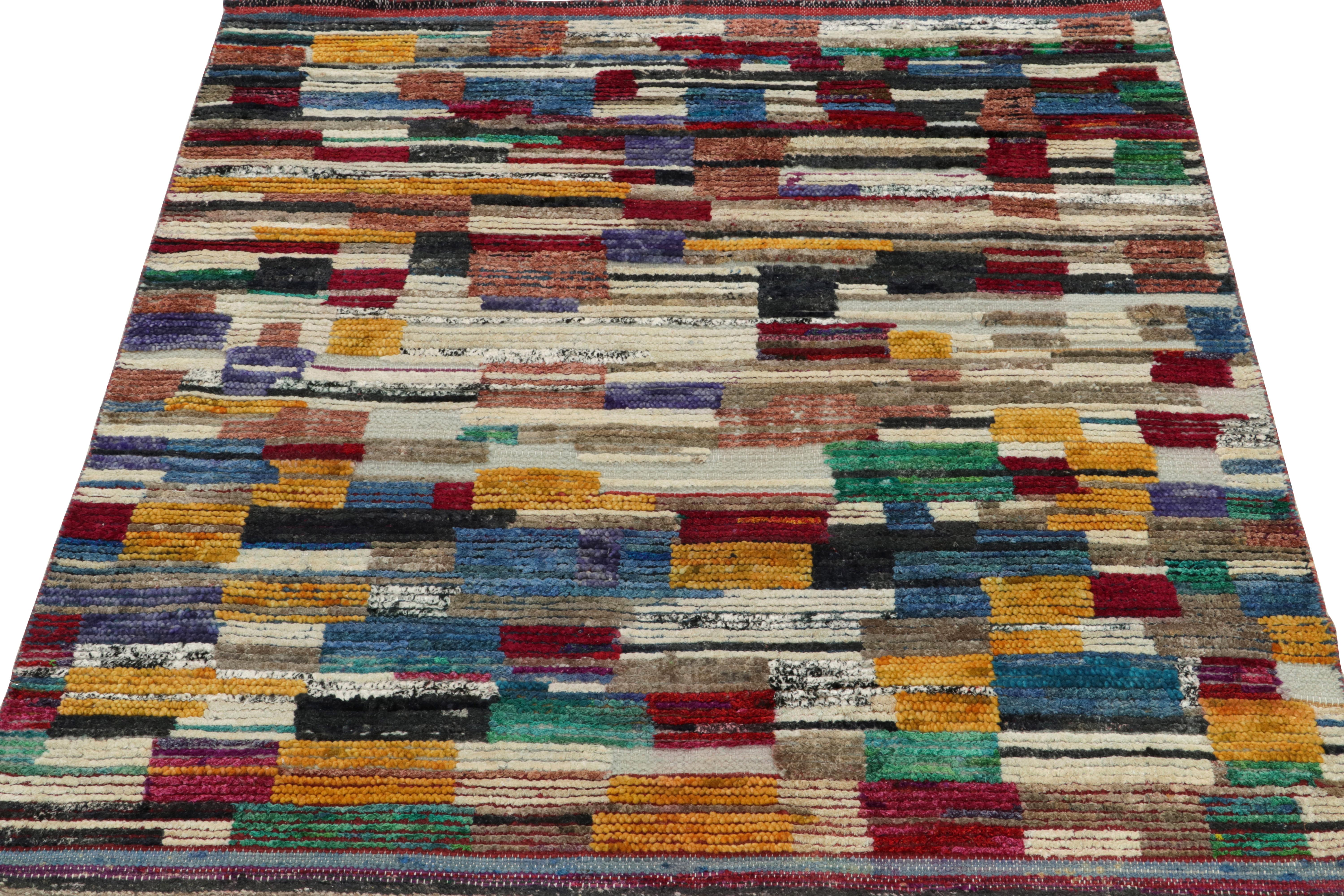 Rug & Kilim’s inventive tribute to Moroccan rug design, connoting an enticing play of variegated shades of gold, scarlet red, blue, white & green blending seamlessly to conclude to a multicolor striated border. Hand-knotted in silk, a 4x5 rug from