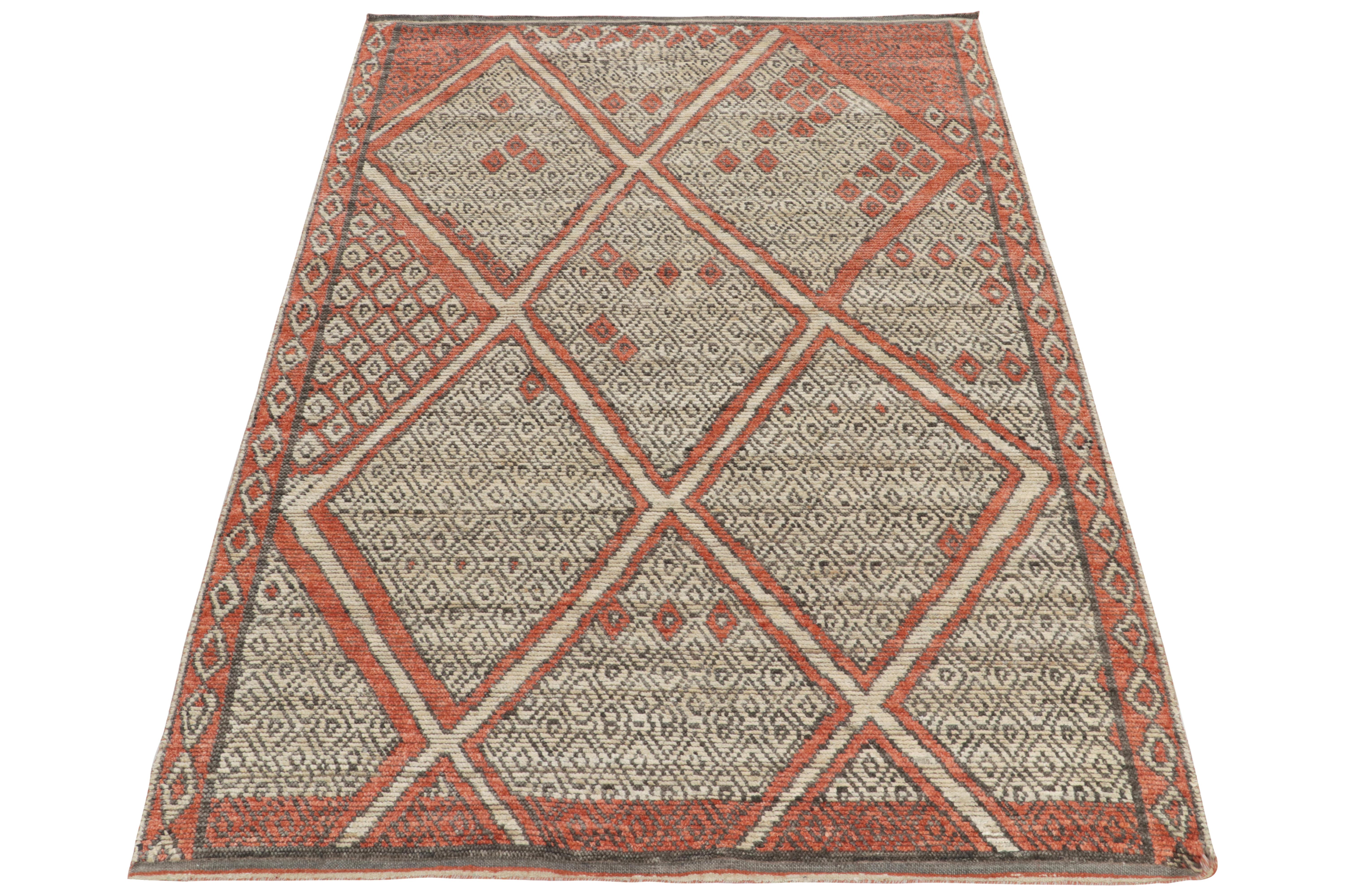 Hand-knotted in fine, luxurious silk, a 6x9 Moroccan style piece from Rug & Kilim. The imagination enjoys scintillating pagination with the idyllic diamond patterns in tangerine, white & black. Marking a bold contemporary take in such rich tribal