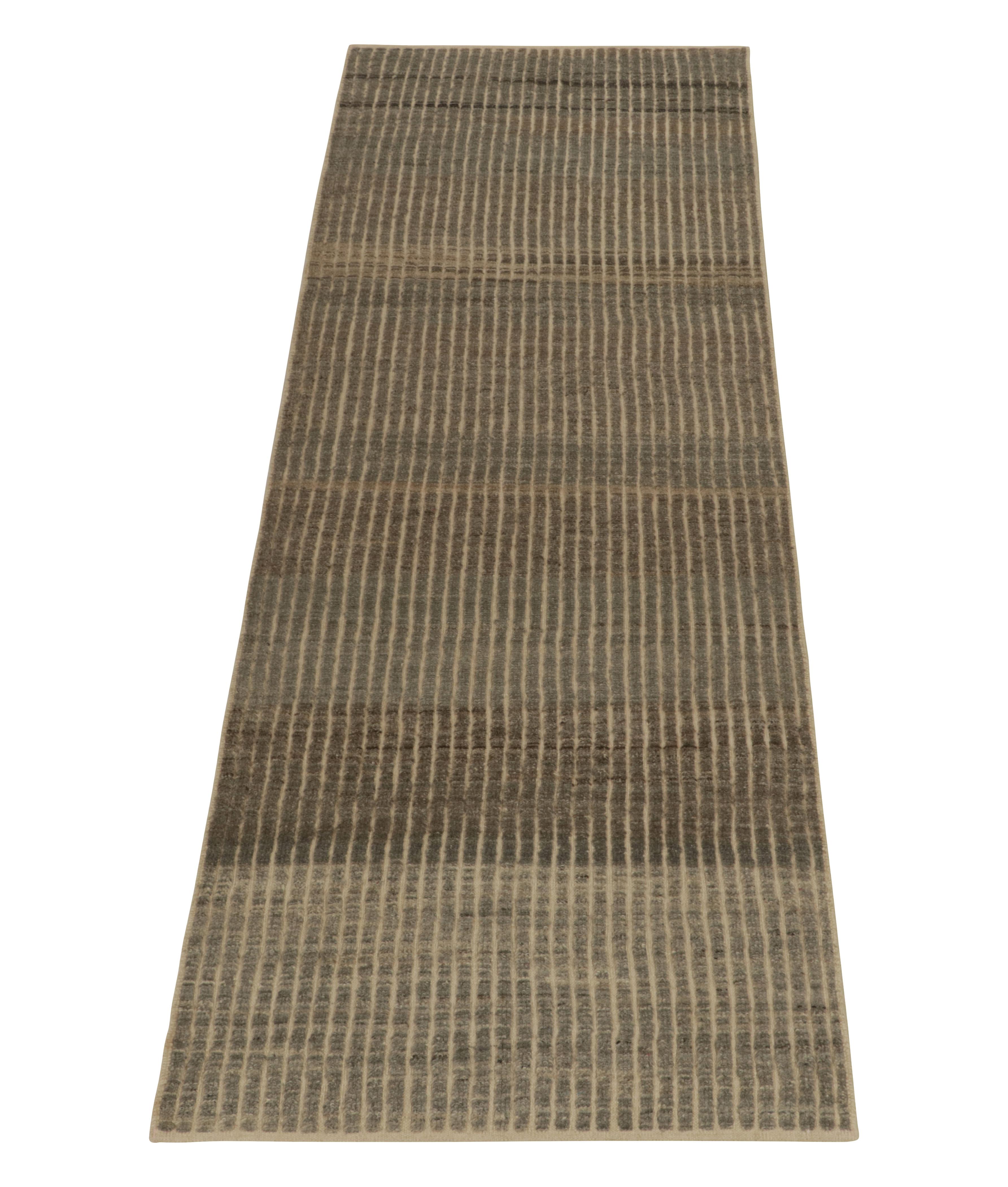 From Rug & Kilim’s modern classic selections, a 3x10 hand-knotted runner relishing Moroccan aesthetics. The vision witnesses a marriage of rich brown, beige, black & gray tones sitting beautifully in a striated pattern for exceptional pagination on