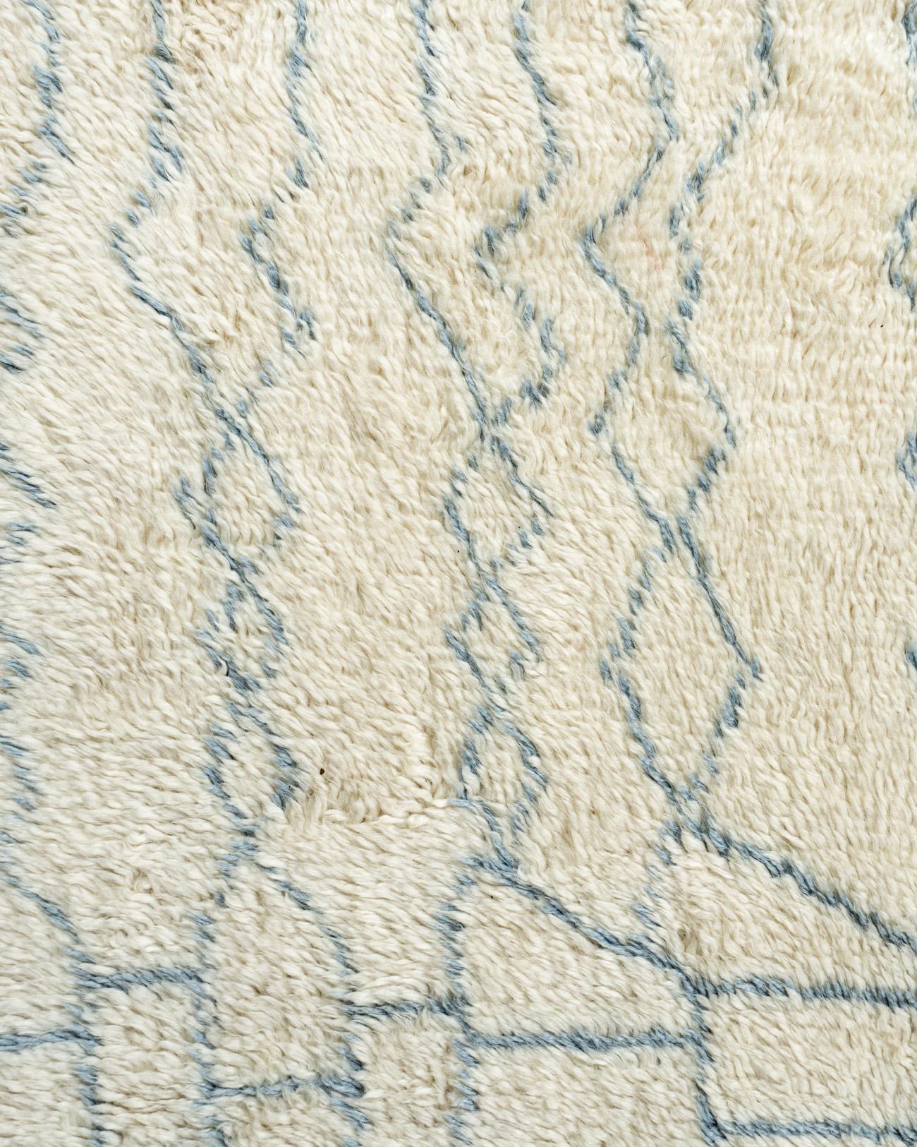 Moroccan style Fluffy Collection rug. 10'5 x 14'. Exotic, chic, and wonderfully versatile, Moroccan rugs continue to soar in popularity, seducing design aficionados with their patterns and palettes. This hand knotted recreation rug will lend its