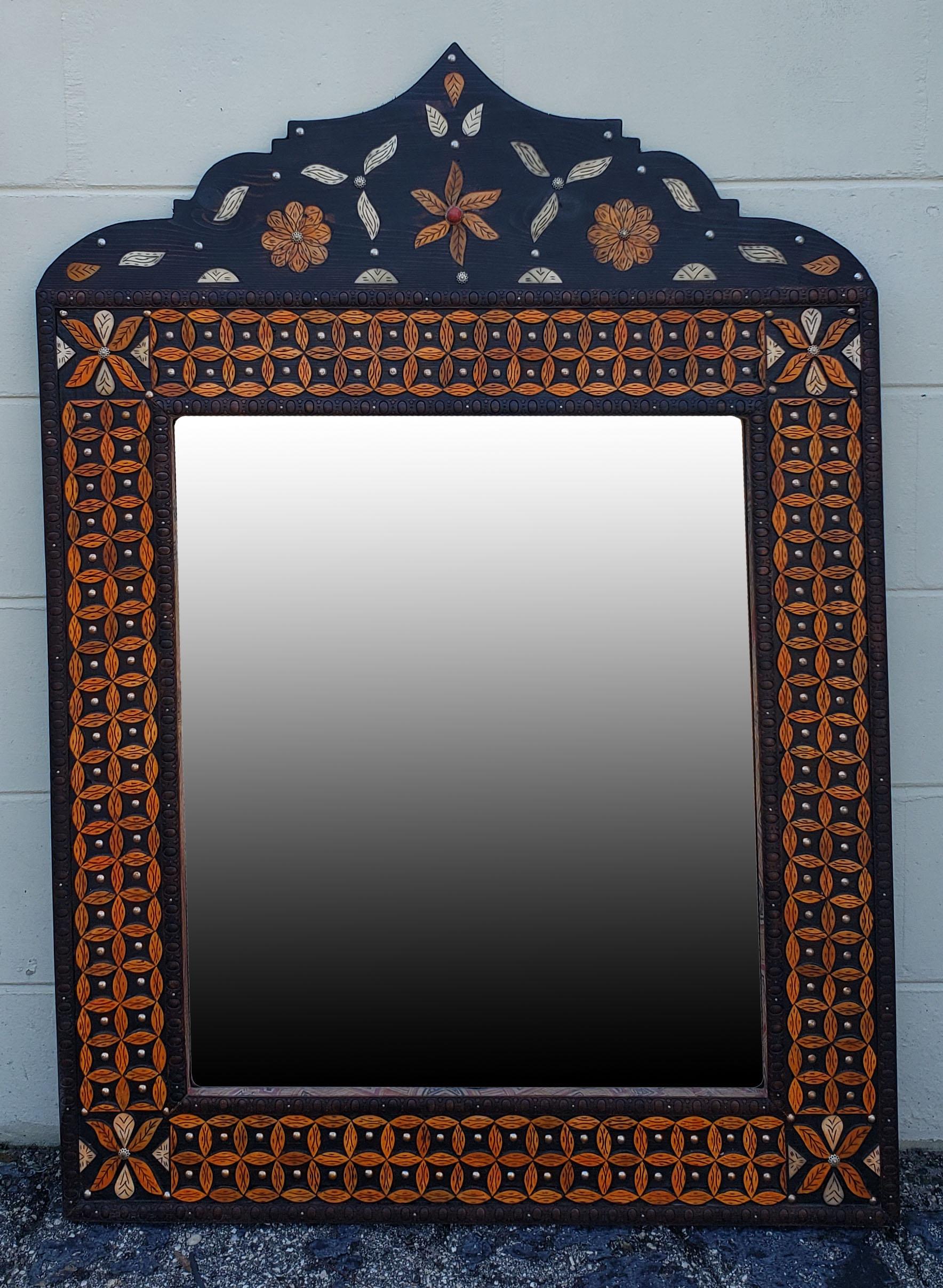 Medium size metal and camel bone inlay Moroccan mirror. Made in the city of Marrakech, this mirror is dome shaped, and measures approximately 43