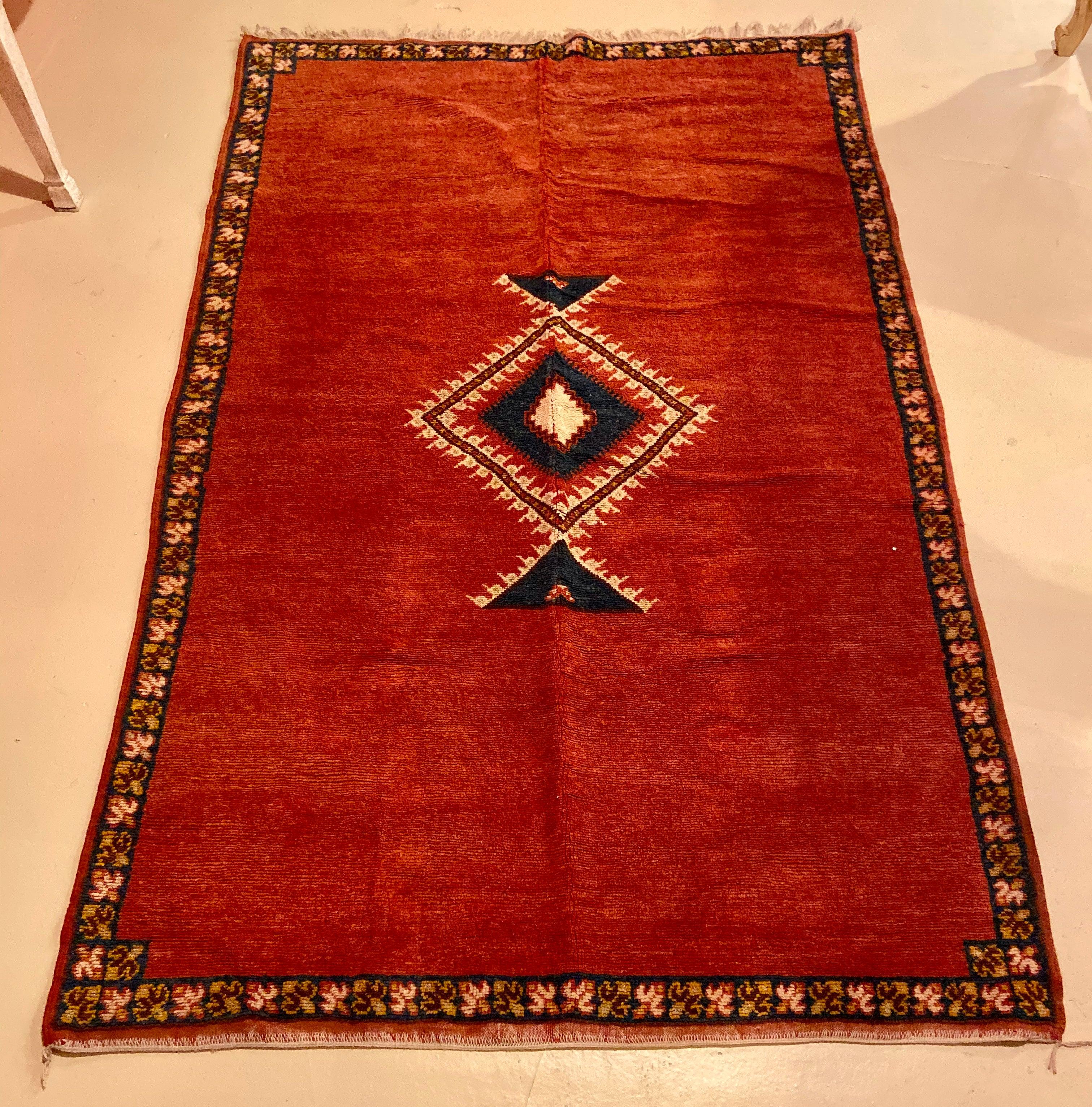 Moroccan tribal handwoven rug or carpet wool with blue diamond on red background. A stunning and sophisticated addition to your living room, dining room, foyer or bedroom

-Handwoven carpet from the Taznacht region of Morocco 
-Made using the