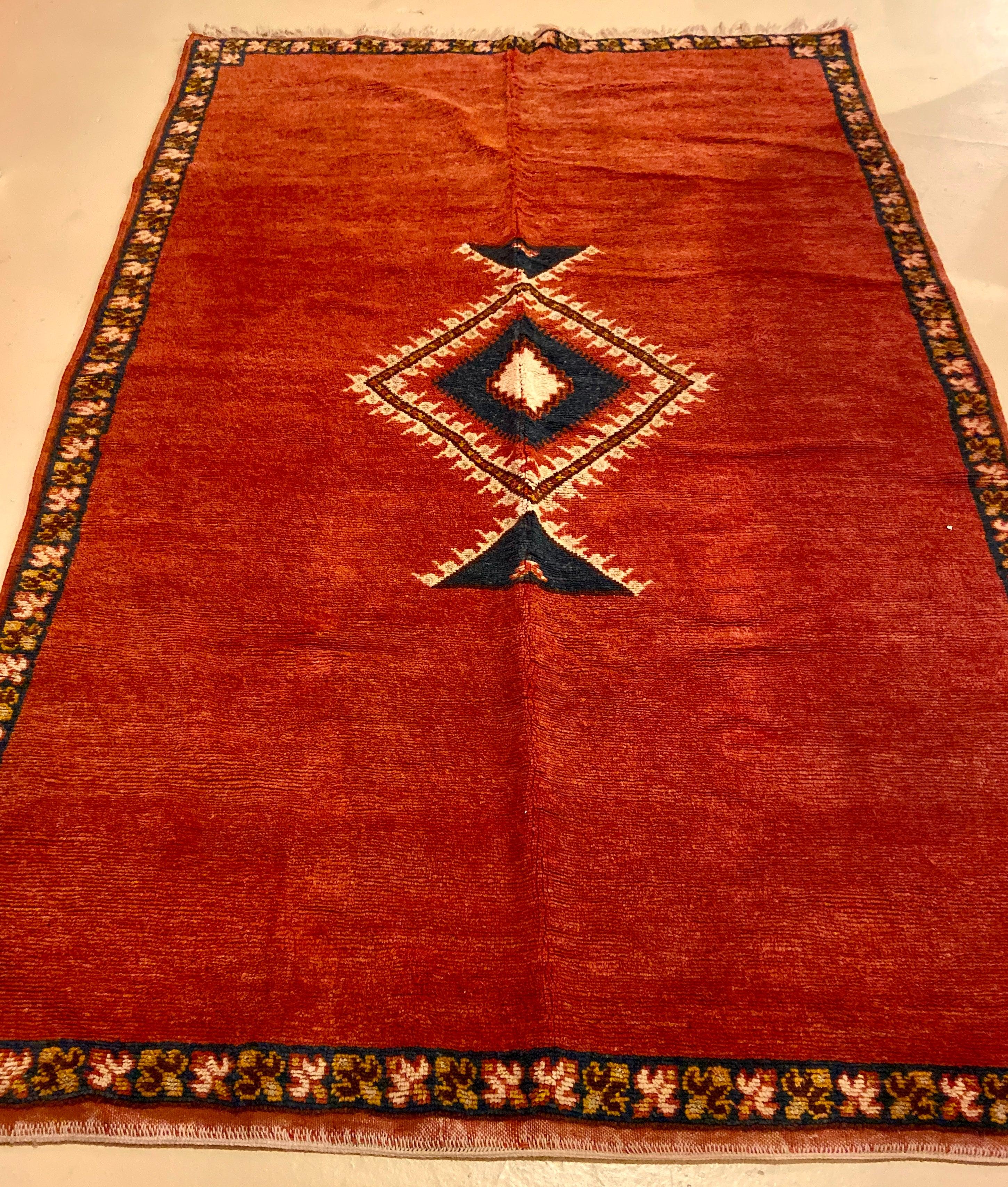 Hand-Woven Moroccan Tribal Handwoven Rug or Carpet Wool with Blue Diamond on Red Background