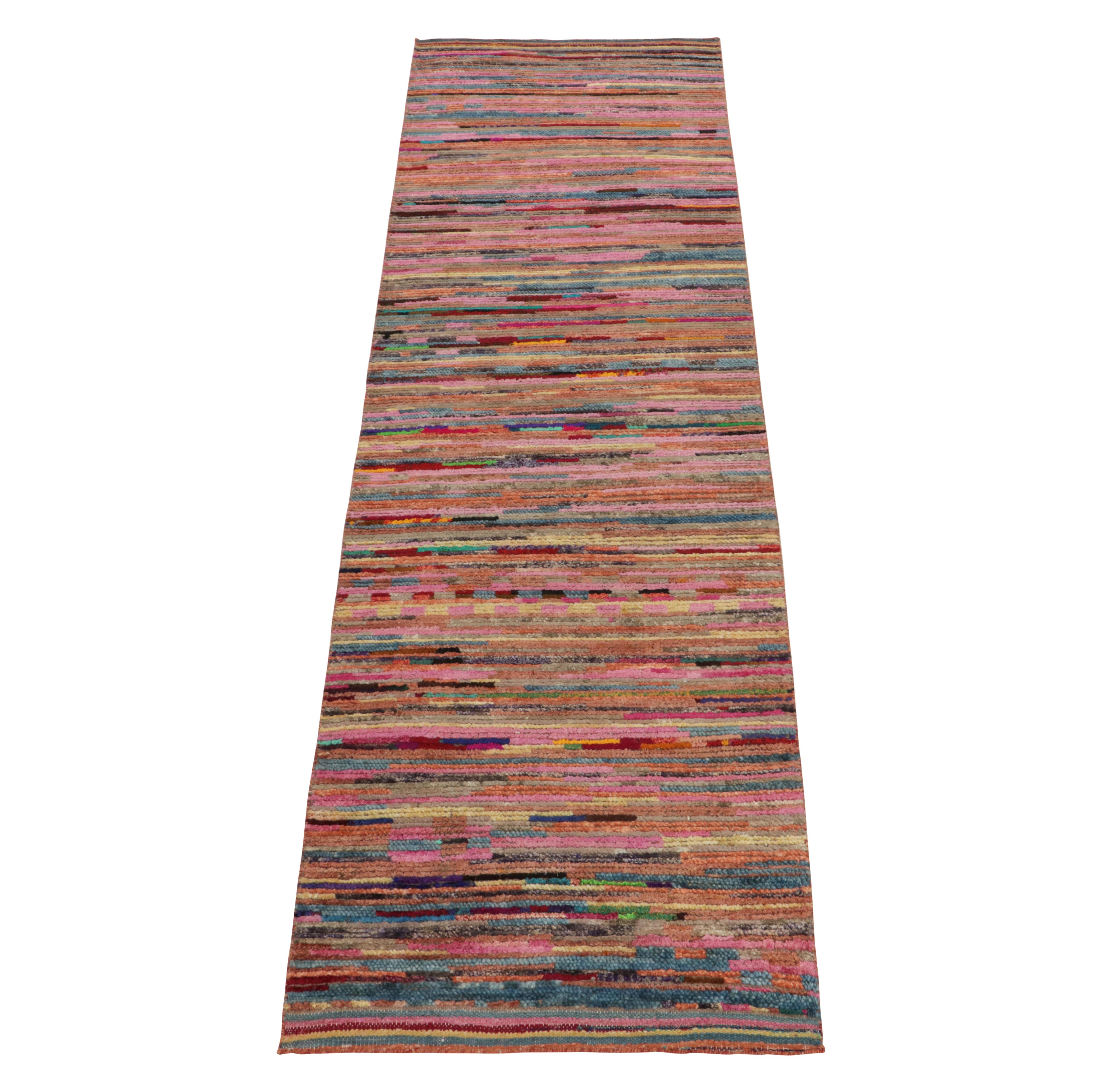 From our contemporary reimagining of Moroccan tribal rugs, a 3x10 runner in hand-knotted silk enjoying an outstanding polychromatic colorway. The pink undertone enjoys striations in a spectrum of colors with a playful sense of movement, uniquely