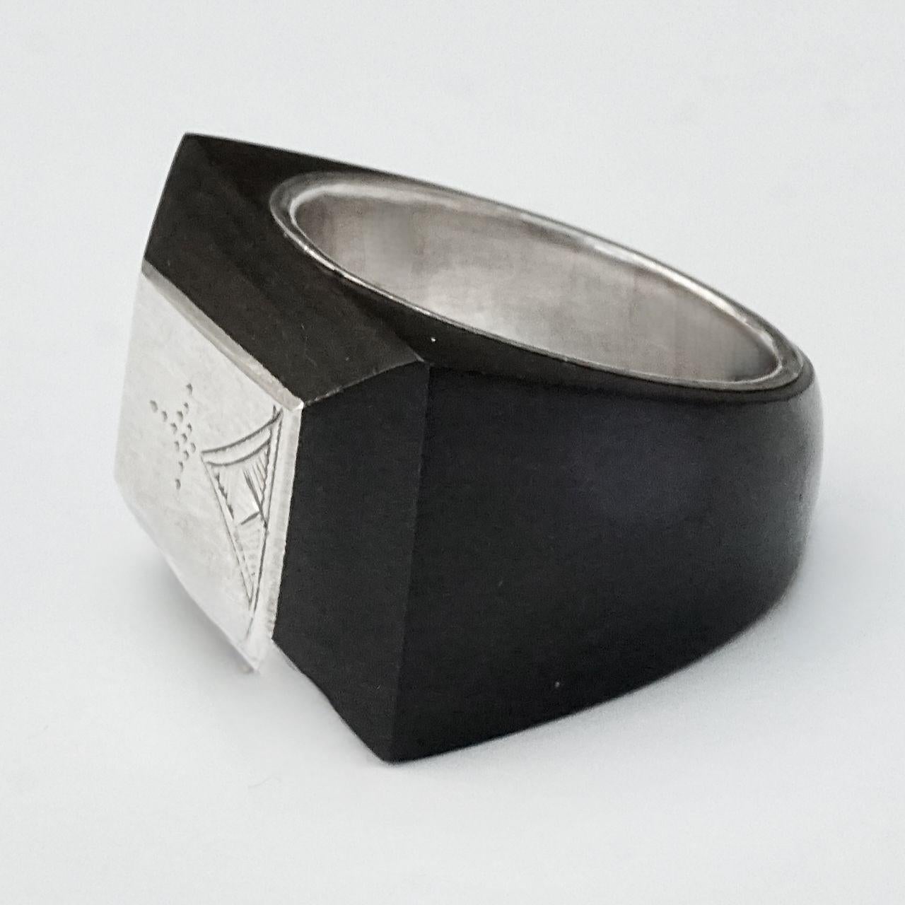 
Beautiful large rectangular Moroccan silver and ebony ring, featuring an etched and line tribal design. It is handmade by Tuaregs, an ethnic people mainly inhabiting the Sahara desert. Ring size UK V, US 10 5/8. The ring tests as silver and