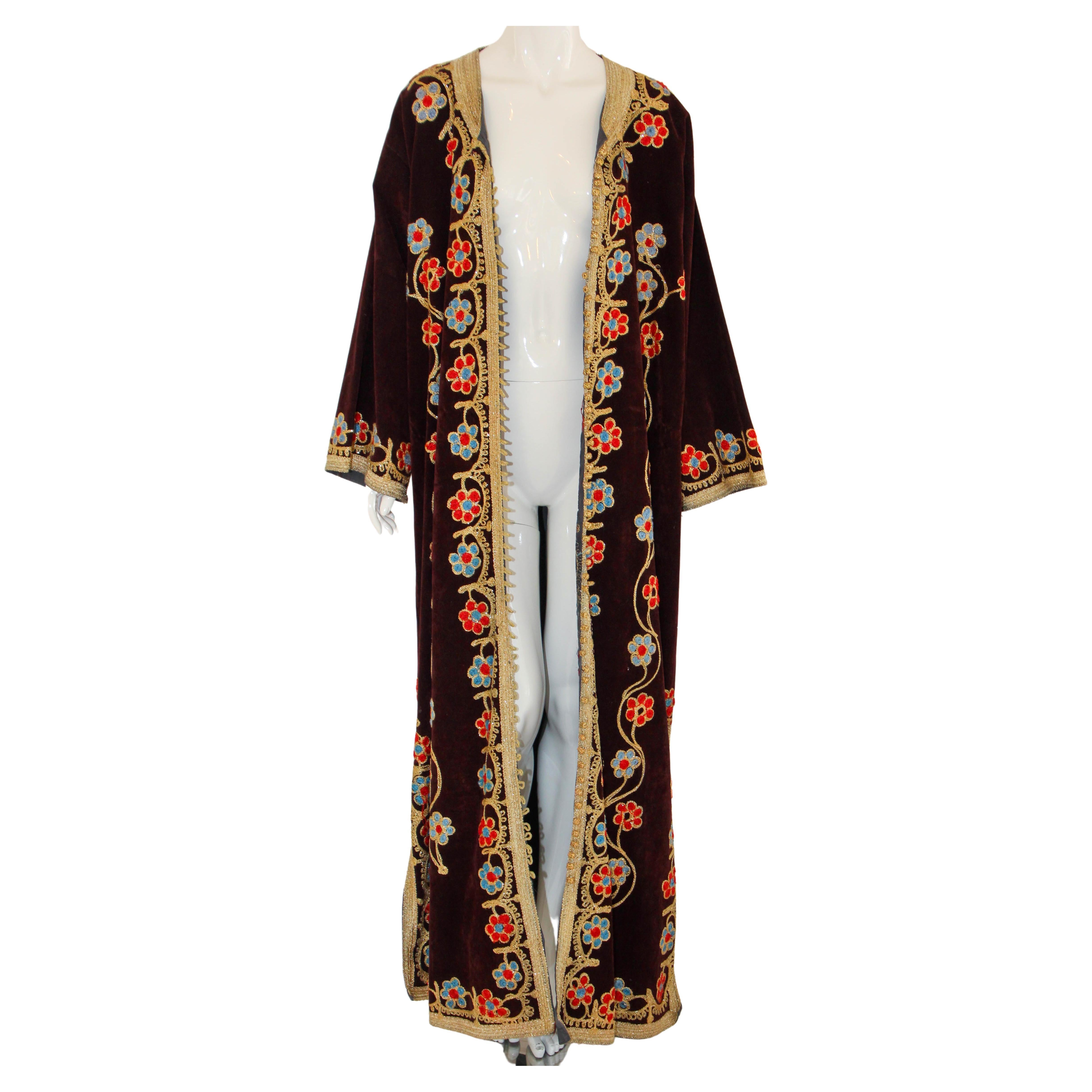 Elegant vintage Moroccan royal caftan velvet embroidered with gold metallic threads loop buttons, open all the way, could be worn open or closed,
circa 1960s.
This long maxi dress velvet Moorish caftan is embroidered and embellished entirely by