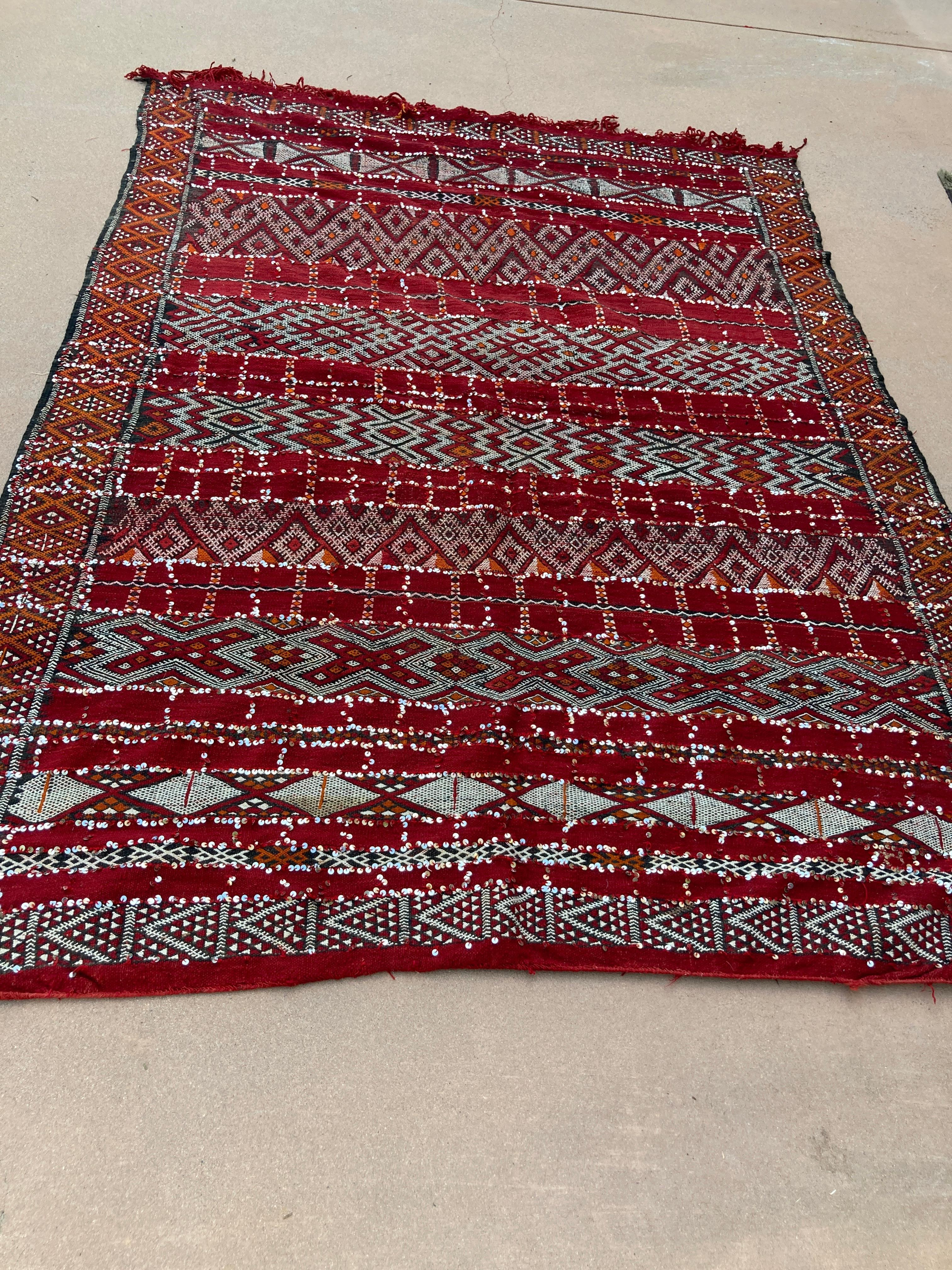 Moroccan tribal wedding rug with sequins North Africa, Handira.
Handwoven vintage Moroccan Berber Tribal Handira ethnic textile.
Moroccan Bohemian style rug, handwoven by the Berber women of the Zemmour tribe for their wedding day.
The design on