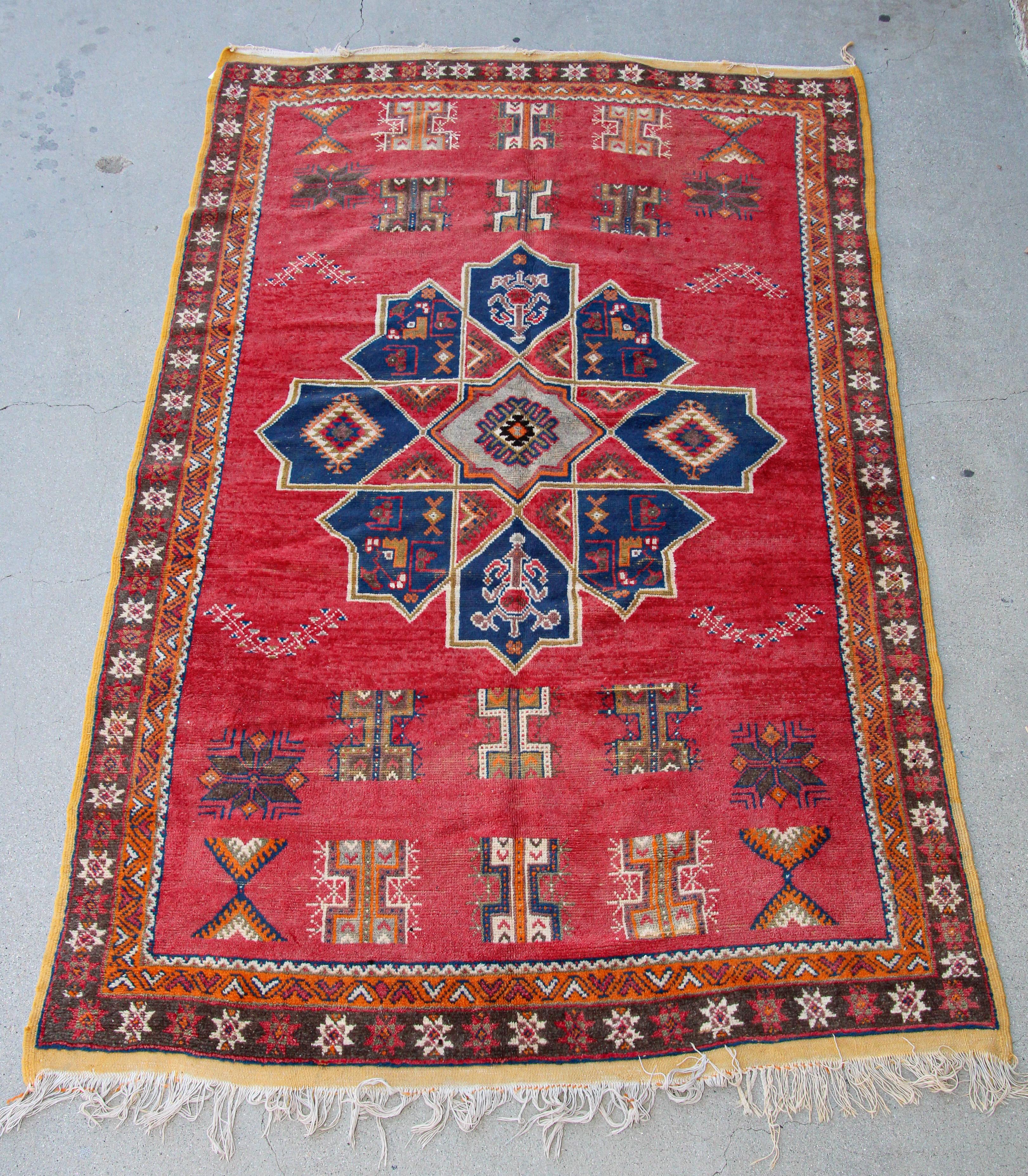 Moroccan vintage tribal rug handwoven by Berber Moroccan women using organic lamb wool and organic dye.
North African Moroccan tribal runner with low pile handwoven wool, hand-knotted by the Berber tribes of Morocco with traditional geometric