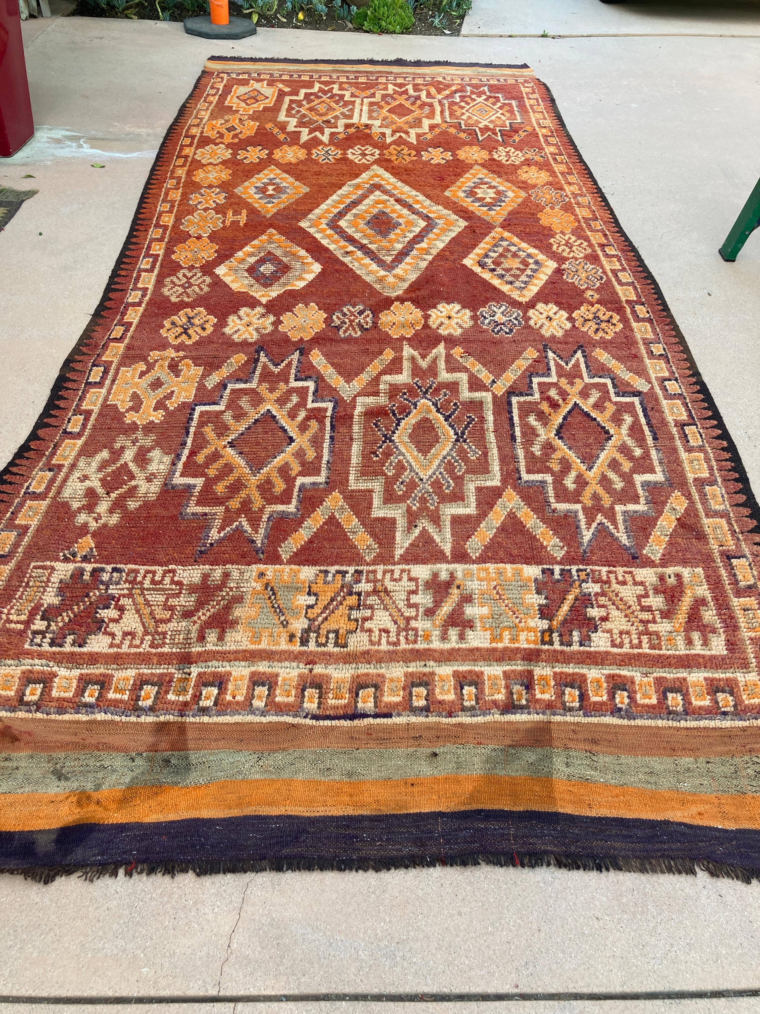 1960s authentic Midcentury Moroccan Area Rug with Tribal Geometric Design.This circa 1960 vintage Moroccan rug features a bd design of diamond medallions flanked by geometric abstractions .The ethnic tribal Moroccan Berber area rug features a series