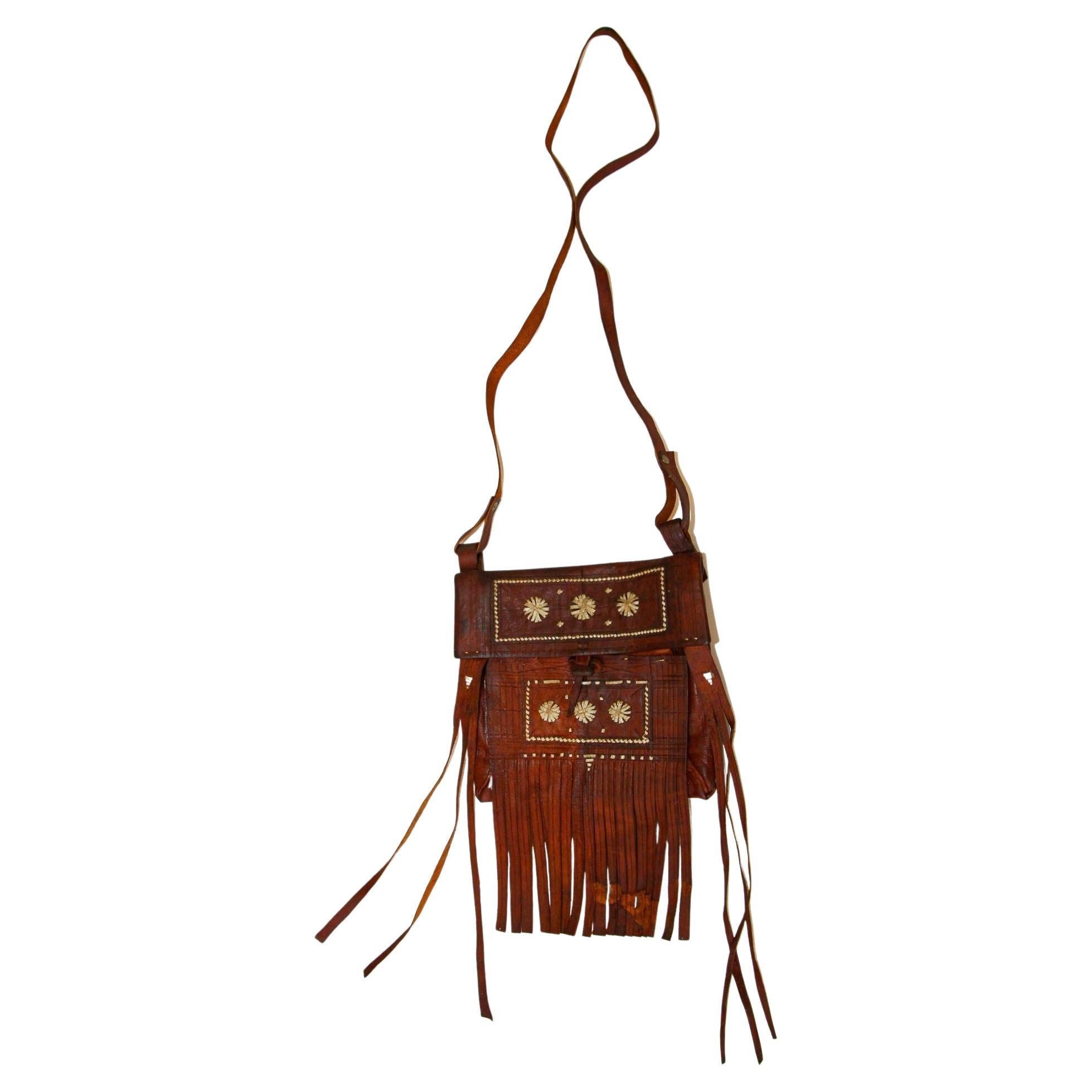 Moroccan Vintage Leather Handcrafted African Tuareg Bag with Fringes Wall Art For Sale