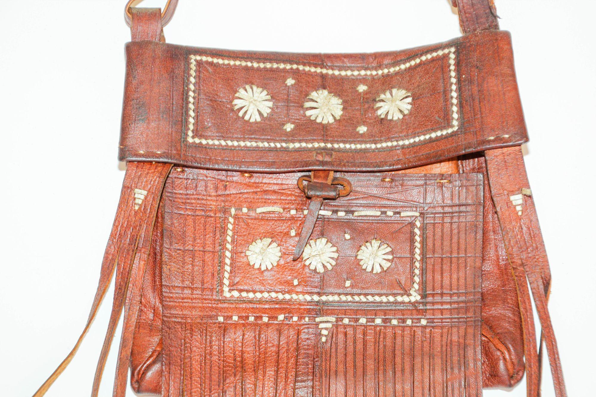 Folk Art Moroccan Vintage Leather Handcrafted African Tuareg Bag with Fringes Wall Art For Sale
