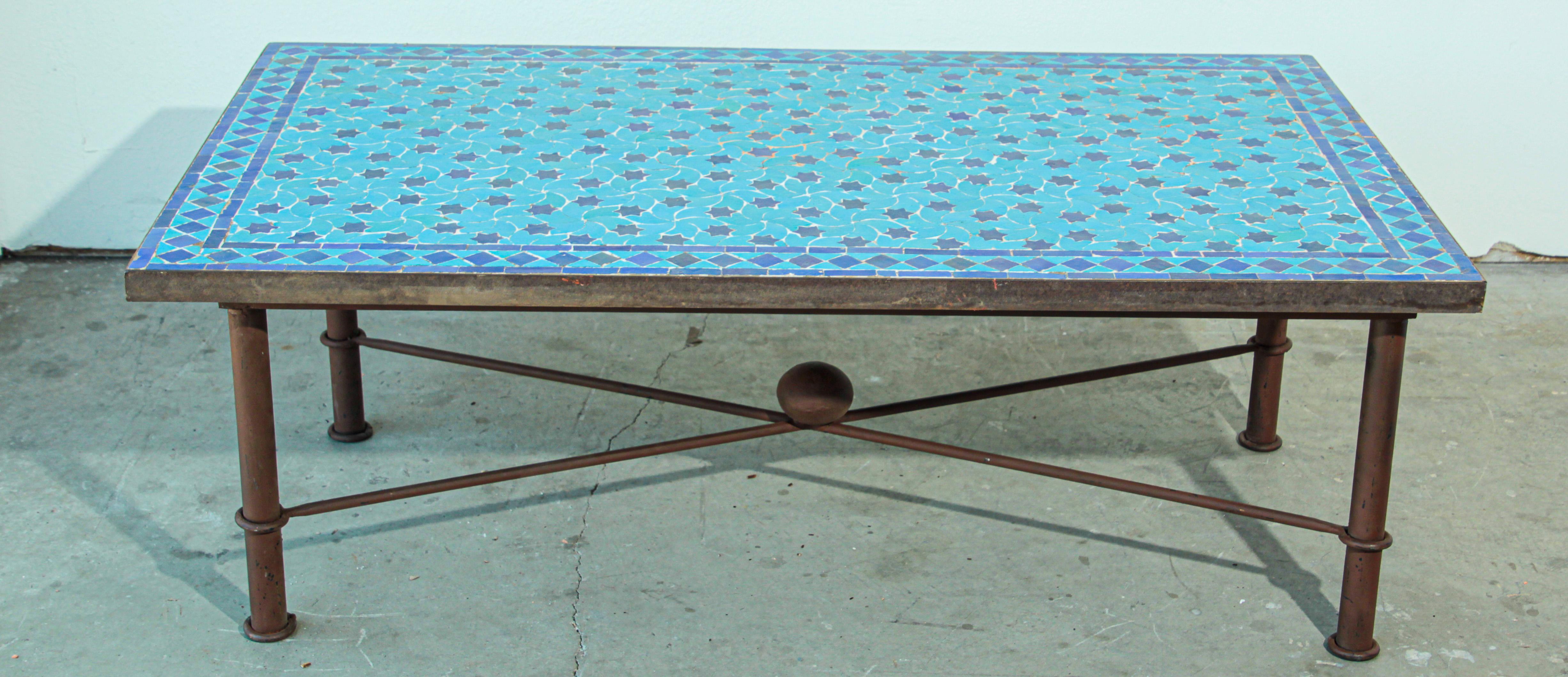 Handcrafted vintage mosaic tile tabletop, handmade using reclaimed Moroccan tiles of different shades turquoise and cobalt blue colors.
Moroccan glazed and hand chased tiles.
Great Moroccan mosaic tile coffee table, delicately handcrafted in fez