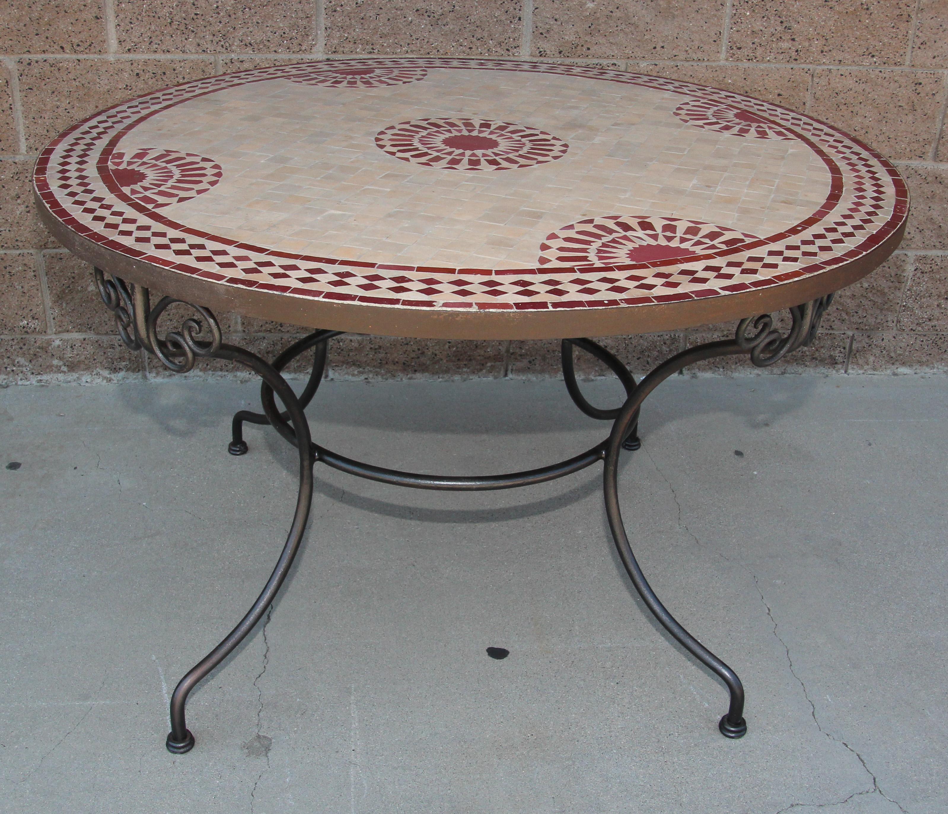Handcrafted round Moroccan outdoor mosaic tile table 47 in. diameter on iron base.
Vintage Classic and elegant Moroccan outdoor mosaic tile table sit on a black wrought iron base.
Handmade in Morocco, the artisans from Fez used the Classic