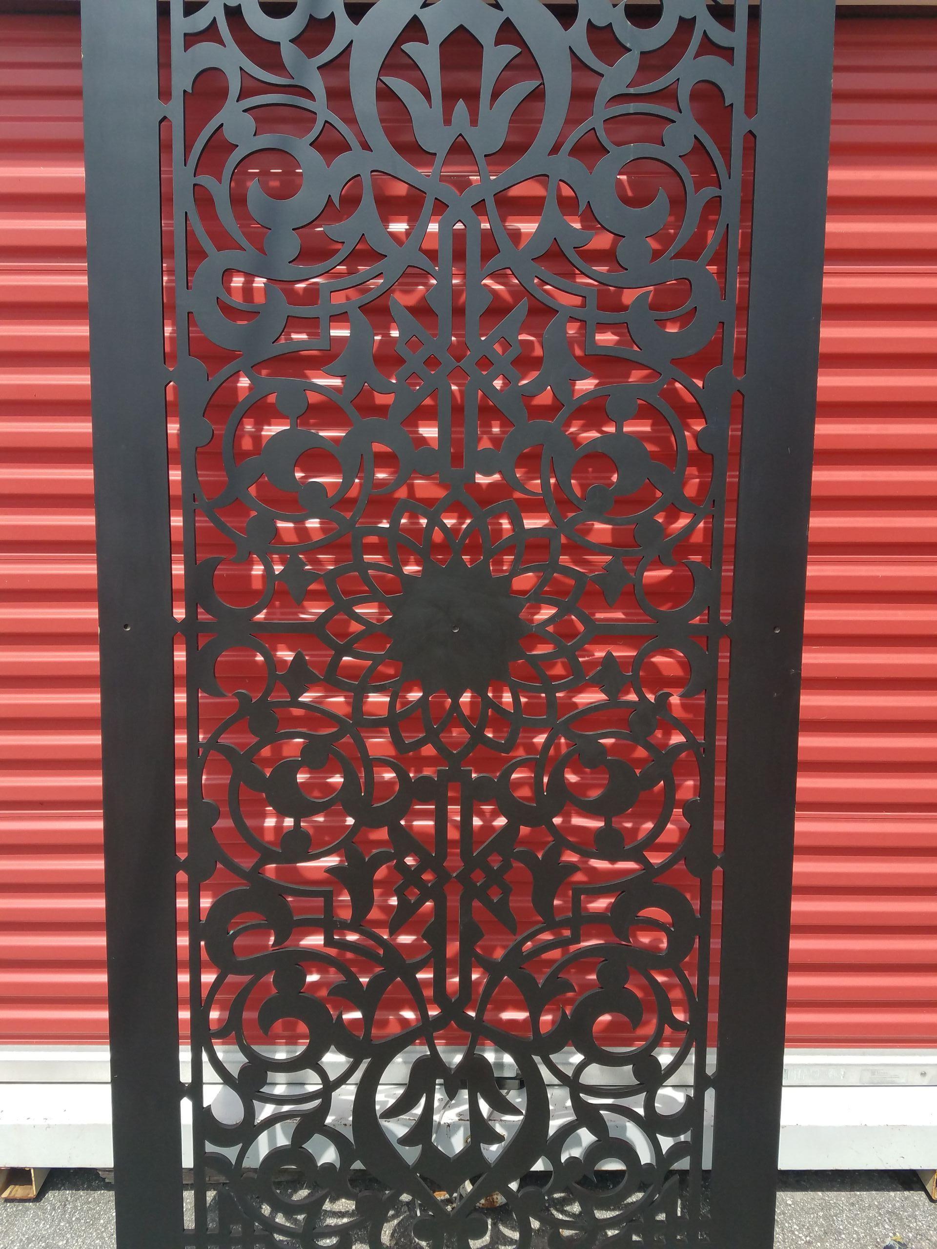 A well carved Moroccan wooden screen divider, featuring an intriguing yet intricate floral medallion design found among the best and most amazing artisans in southern Morocco. Rectangular shape. Color is dark brown. With its detailed carving