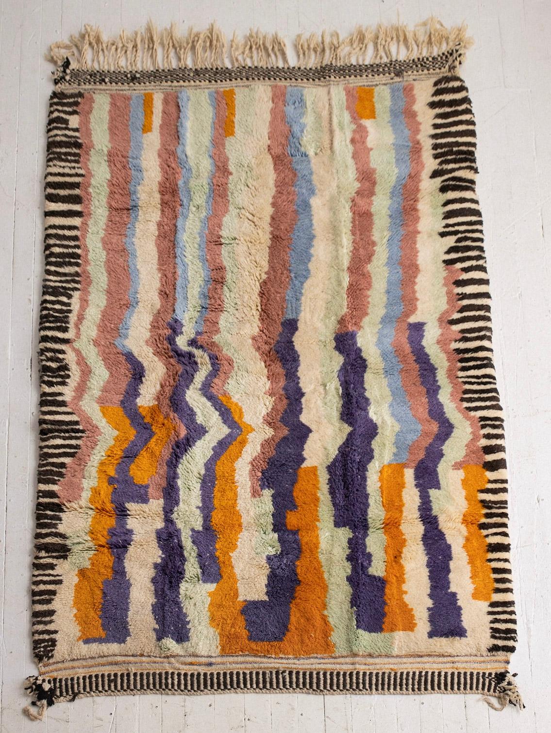 Hand knotted Moroccan wool rug. High pile shag. Memphis Milano inspired graphic pattern in a warm pastel color pallet.
