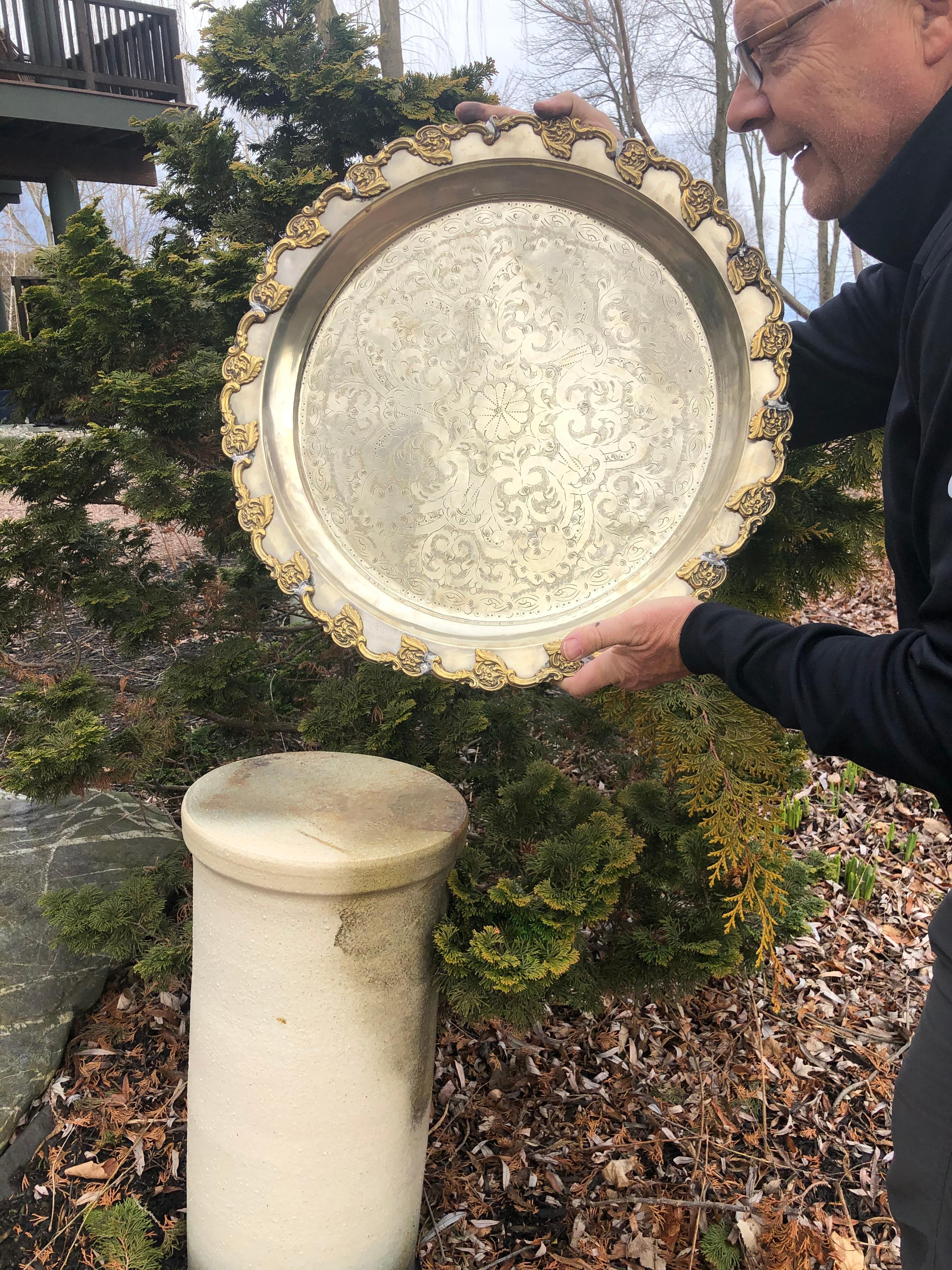 Flowers galore

From an old Moroccan collection comes this beautiful large round engraved and hand-hammered tray, signed by its maker in a silver finish. The incised floriate surface designs are hand chiseled and pleasingly decorative.

This is
