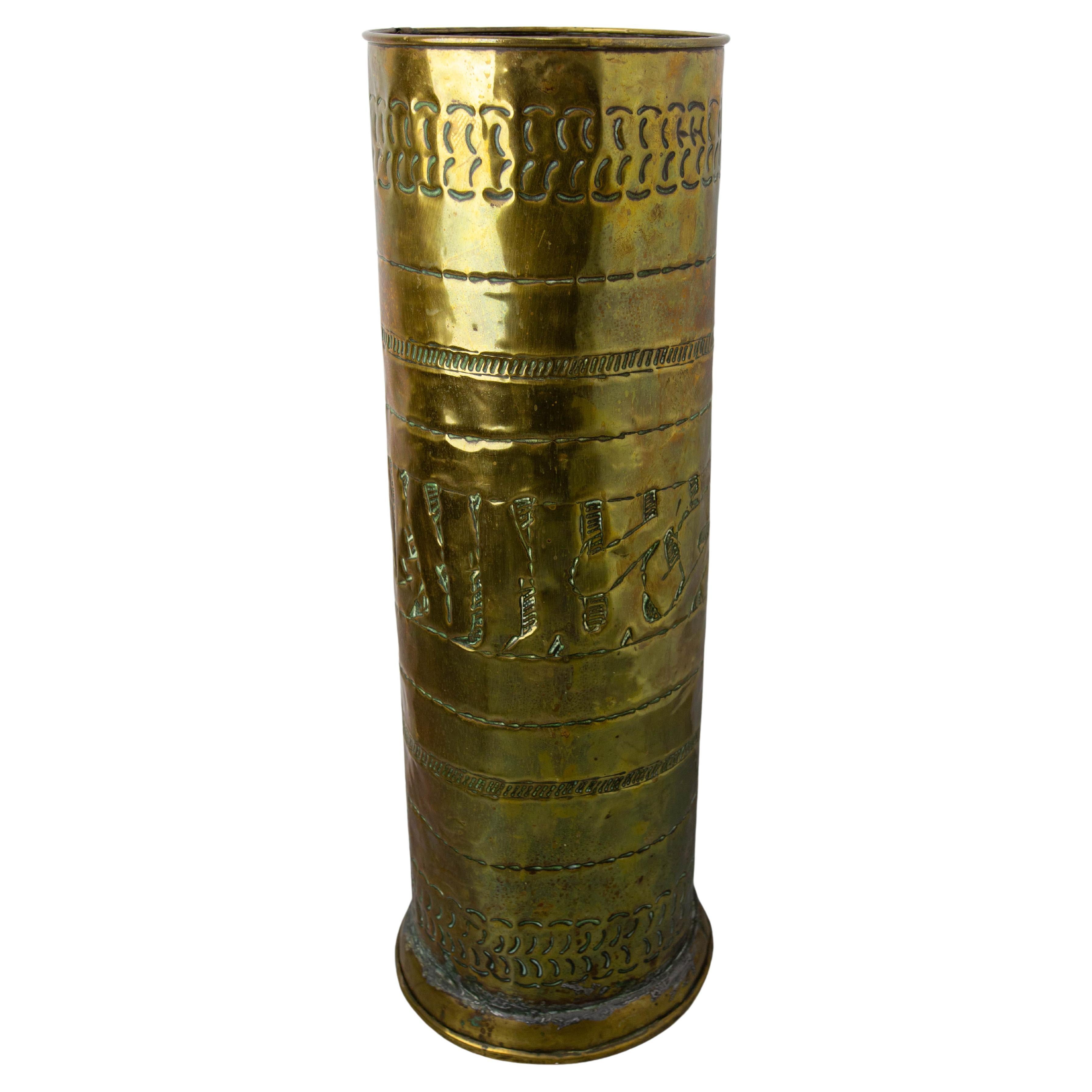 Embossed brass umbrella stand, decorated with geometric motifs and Arabic characters.
Can be used as a decorative container for plants or bouquets.
Made in Moracco in the beginning of the 20th century.

Good condition with marks of use.
