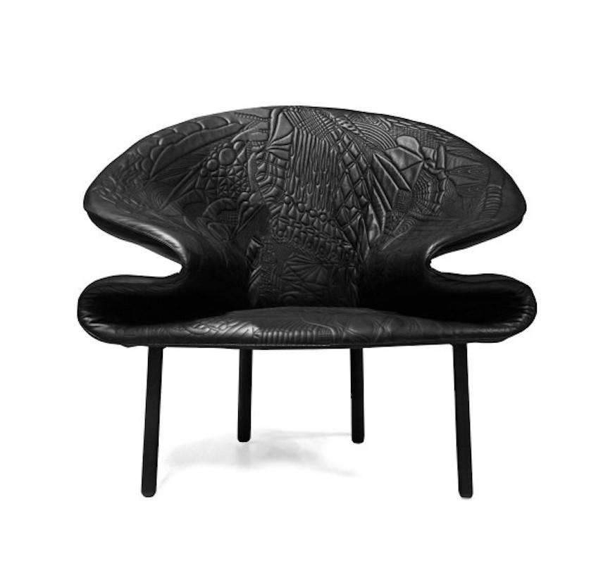 Armchair by Front Design in leather with embroidered pattern. Made from injected polyurethane foam over a steel structure. Feet are in tubular black steel.