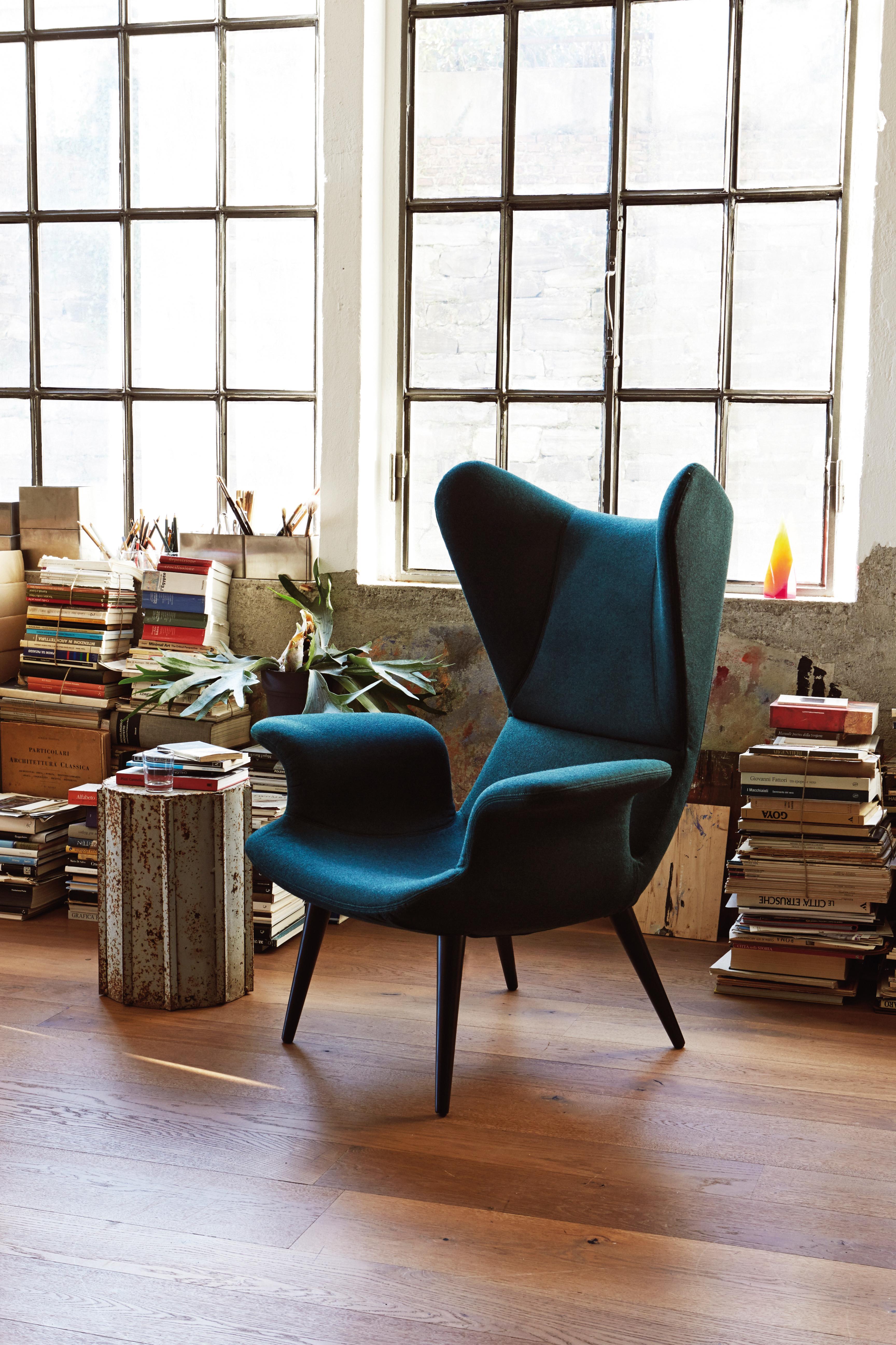 Retuning a Classic! Like a 1960s motorcycle with a new engine, every bit the attitude, but still a modern machine. A high back lounge chair with constant flowing lines, this has been designed as a personal space within the home or office for the