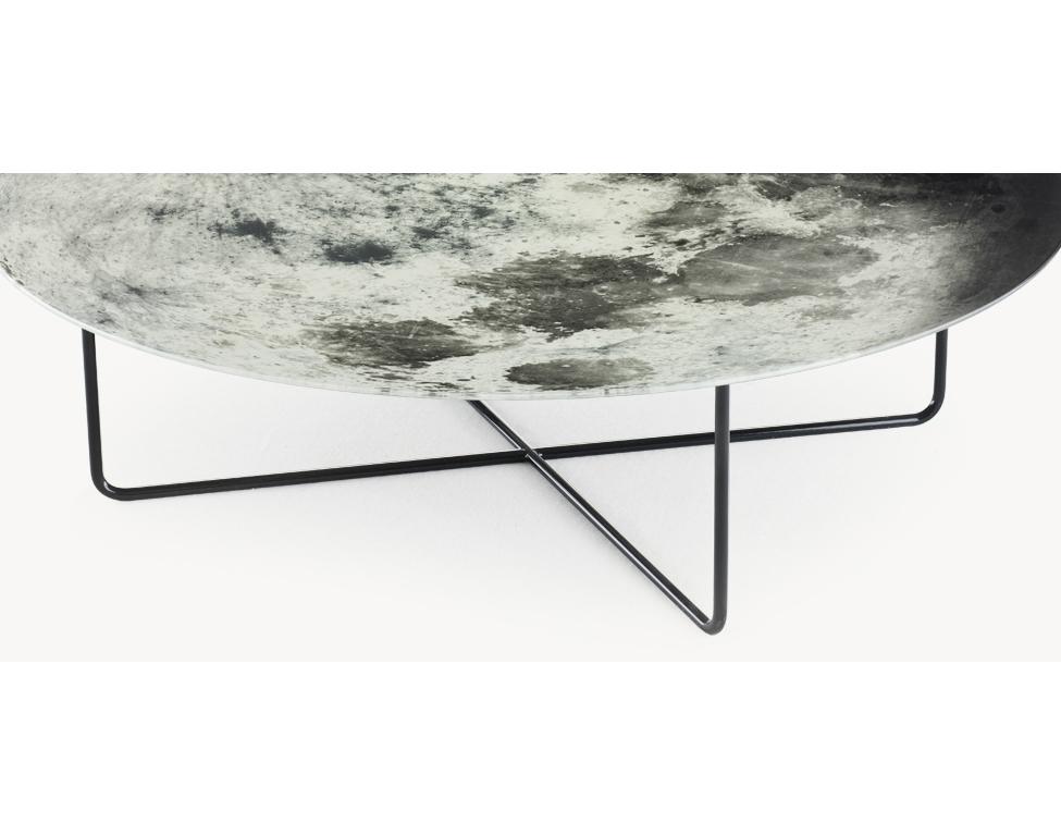 Placed in the centre of the room, the My Moon My Mirror table is your personal piece of the night sky. The moon printed on the mirrored surface combines function and fantasy. Let yourself go and howl at the moon.

Top is made of a silvery tempered