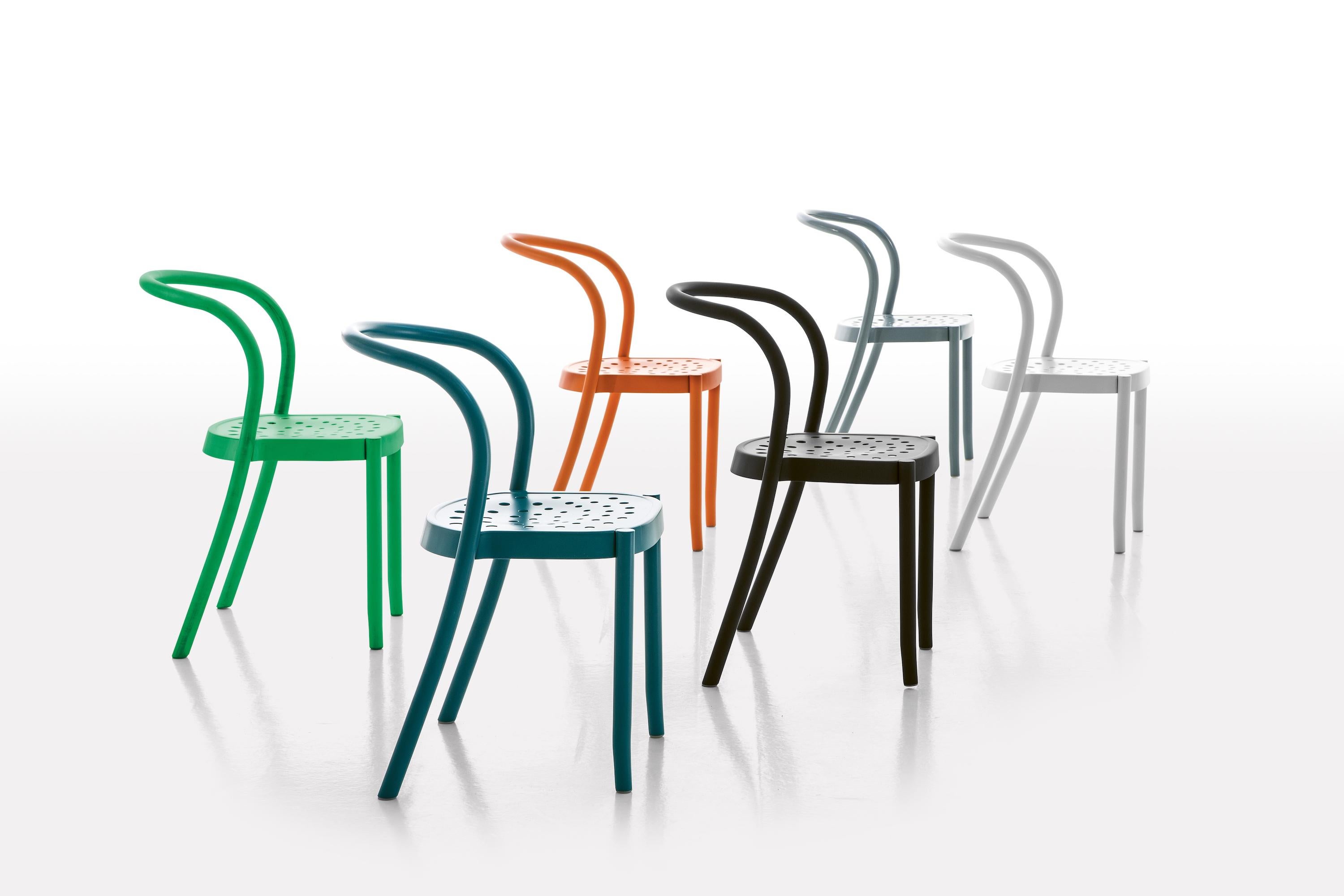 Moroso St Mark Dining Chair in 4 colors Powder Coated Aluminum for Outdoor Use. 

A homage to the “lowly” tradition of the chair made contemporary by using two apparently contrasting materials. With its solidity and comfort the form appears to