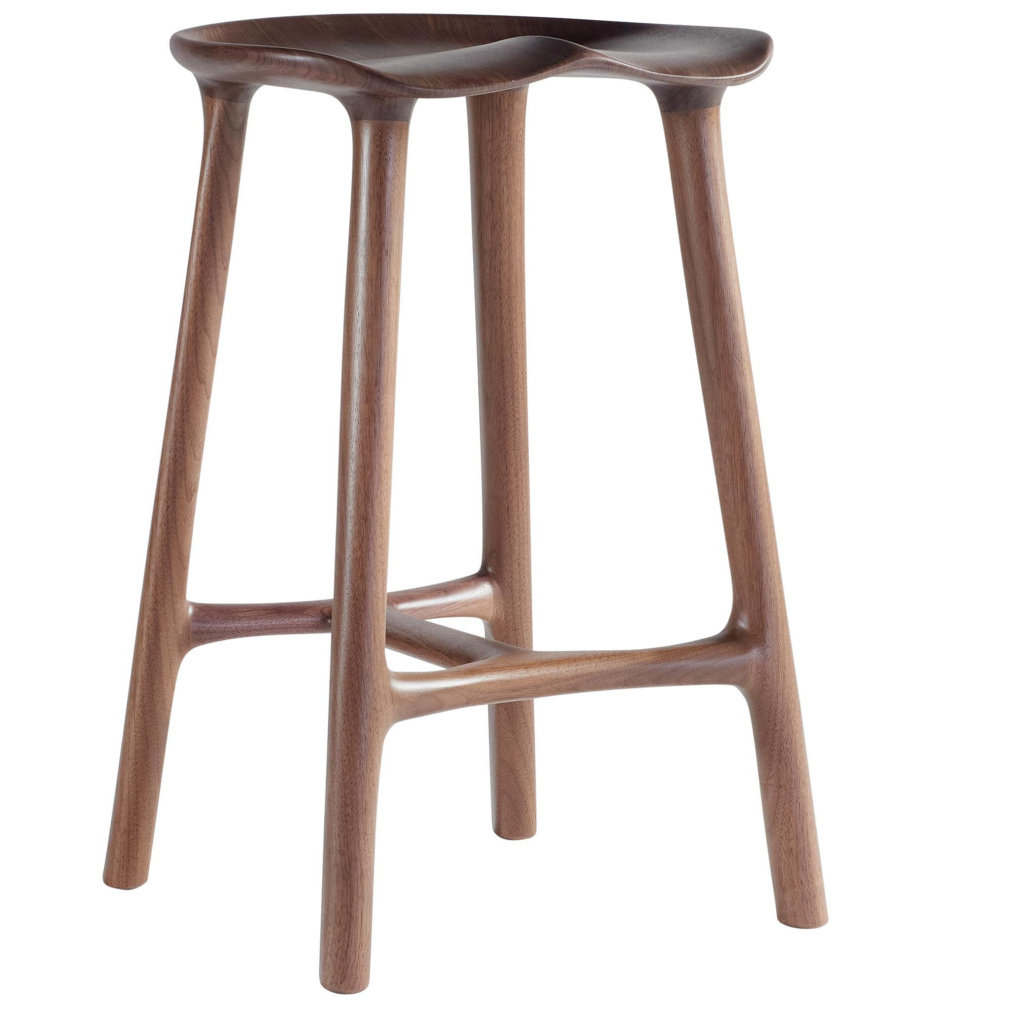 The Morphe Stool combines form and function seamlessly. Its organic silhouette and contoured seat offer a comfortable perch and bold, unique aesthetics. The Morphe Stool is crafted from North American Hardwoods with mortise and tenon joinery. This