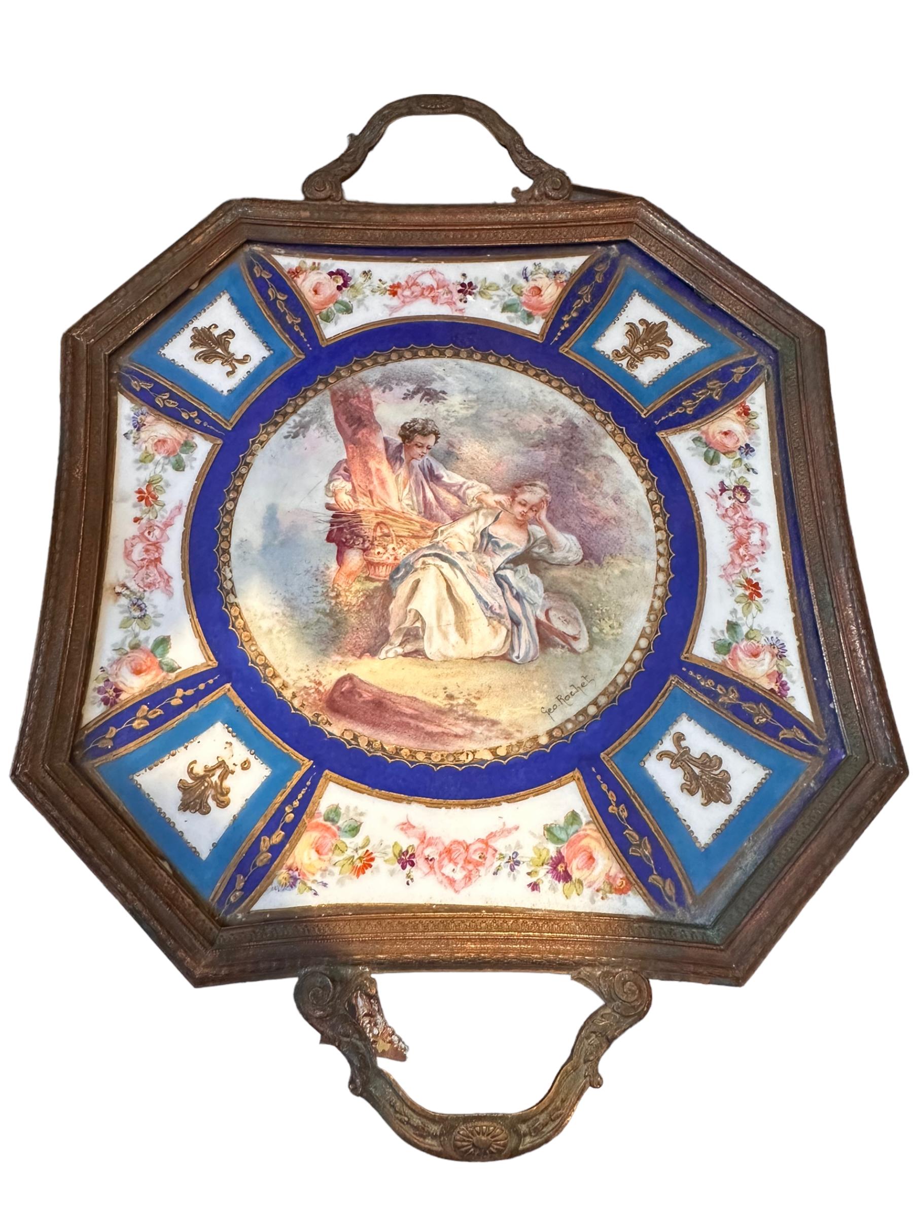 This piece is over 150 years old. Made by the famous Sevres Porcelain, this brand at one time created pieces for Marie Antoinette and Napoleon. In great condition for the age with a chipped edge covered by the brass tray surround, some loss to