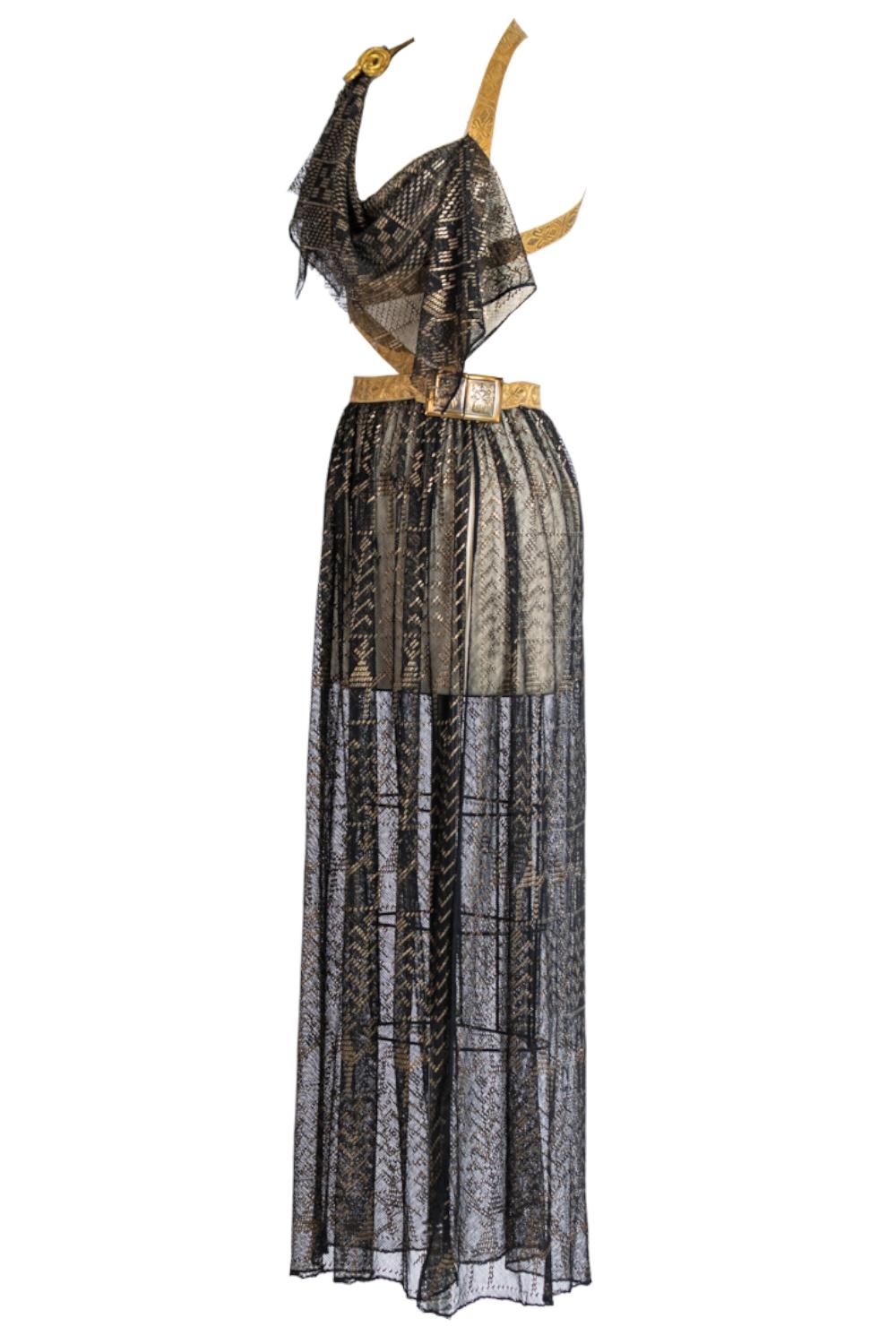 The textiles used to make this gown are 100 years old and have built up a beautiful antique patina to the gilt brass details. MORPHEW ATELIER Black & Gold Cotton Net Antique Egyptian Assuit Gown With Military Brass Braid Epaulet 