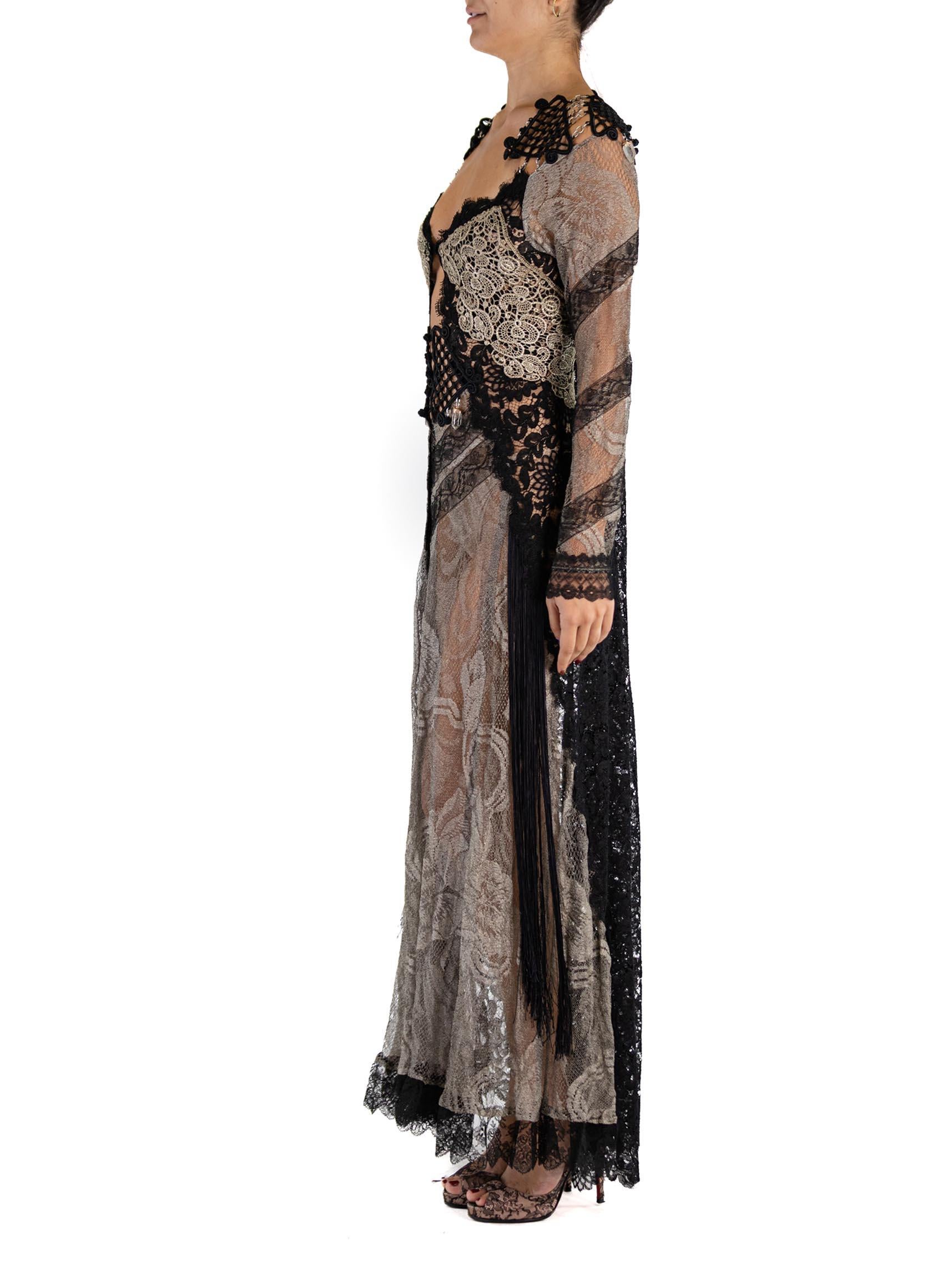 This gown is made from antique 1920s metallic lace woven with real silver. With Victorian hand made passementerie at the shoulders, linked together with chain links and finished off with a few dangling real quartz crystals. The sleeves and hem are
