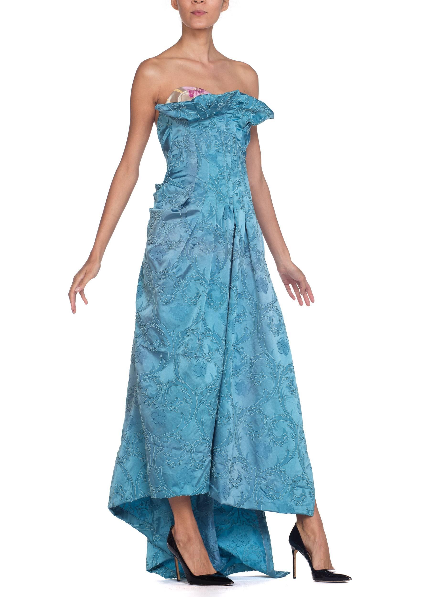 Made from upcycled fabrics from the 1950s & 1940s so there are some areas of slight fading to the fabrics but this is seen as a sign of their age and beauty, adding to the askew beauty of this gown.  MORPHEW COLLECTION Aquamarine Blue Rayon & Silk