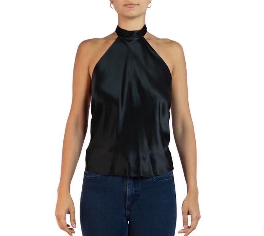 Morphew Collection Black Charmeuse Halter Tie Scarf Top
MORPHEW COLLECTION is made entirely by hand in our NYC Ateliér of rare antique materials sourced from around the globe. Our sustainable vintage materials represent over a century of design,